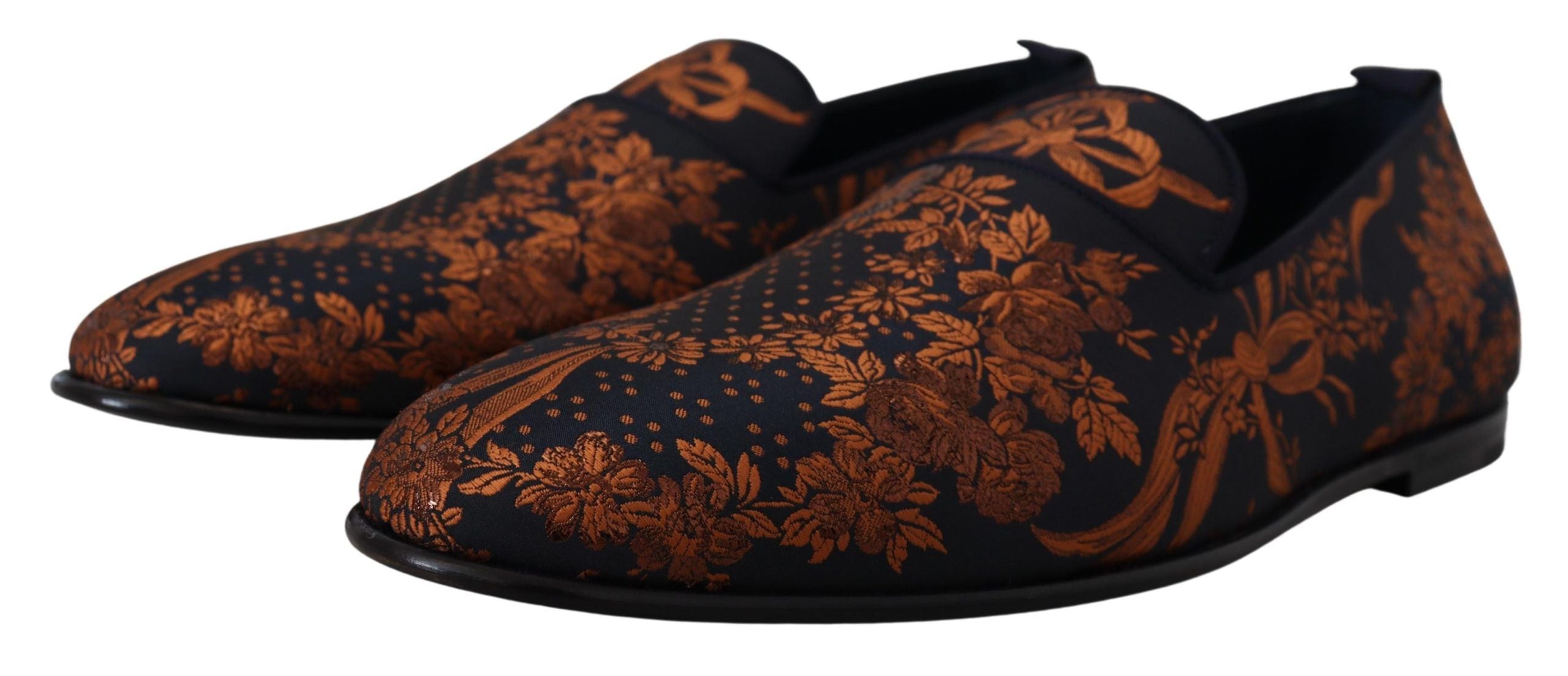 Indulge in the exquisite Dolce & Gabbana Blue Rust Floral Slippers, where luxurious craftsmanship meets captivating design, elevating every step with Italian elegance.