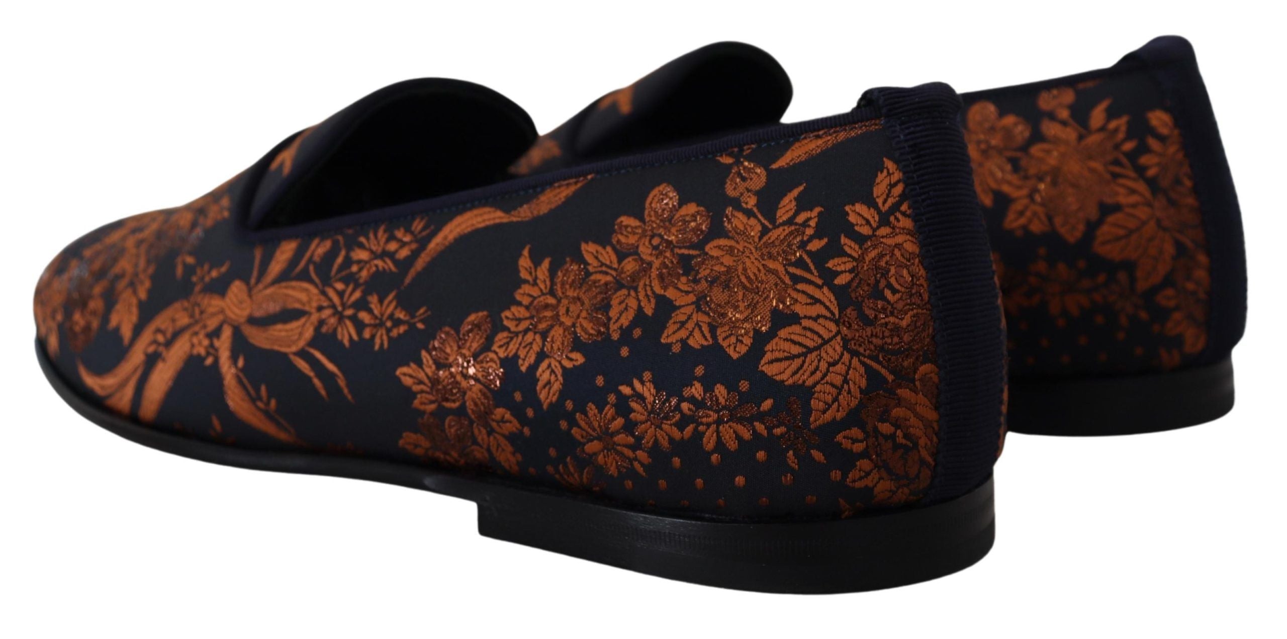Elevate your style with Dolce & Gabbana's Blue Rust Floral Slippers, a luxurious blend of comfort and Italian craftsmanship, perfect for the discerning individual.