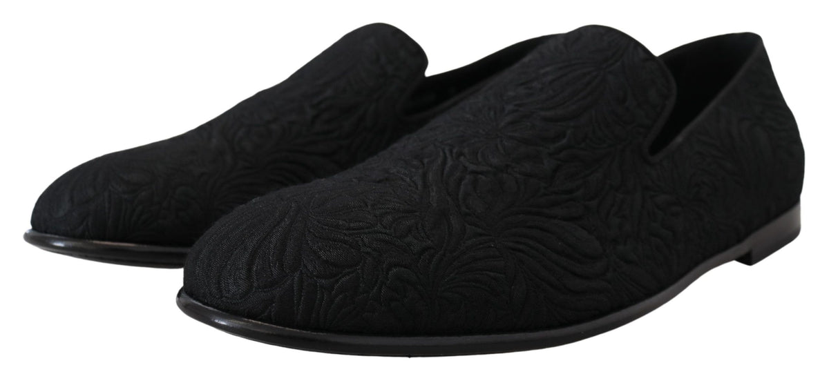 Indulge in the exquisite Dolce & Gabbana Black Floral Jacquard Slippers, handcrafted in Italy for timeless elegance, merging luxury with effortless sophistication.