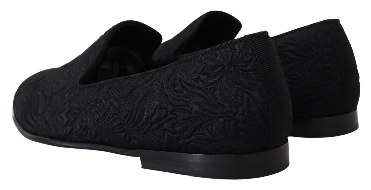 Indulge in the exquisite Dolce & Gabbana Black Floral Jacquard Slippers, handcrafted in Italy for timeless elegance and effortless sophistication, perfect for the discerning connoisseur.