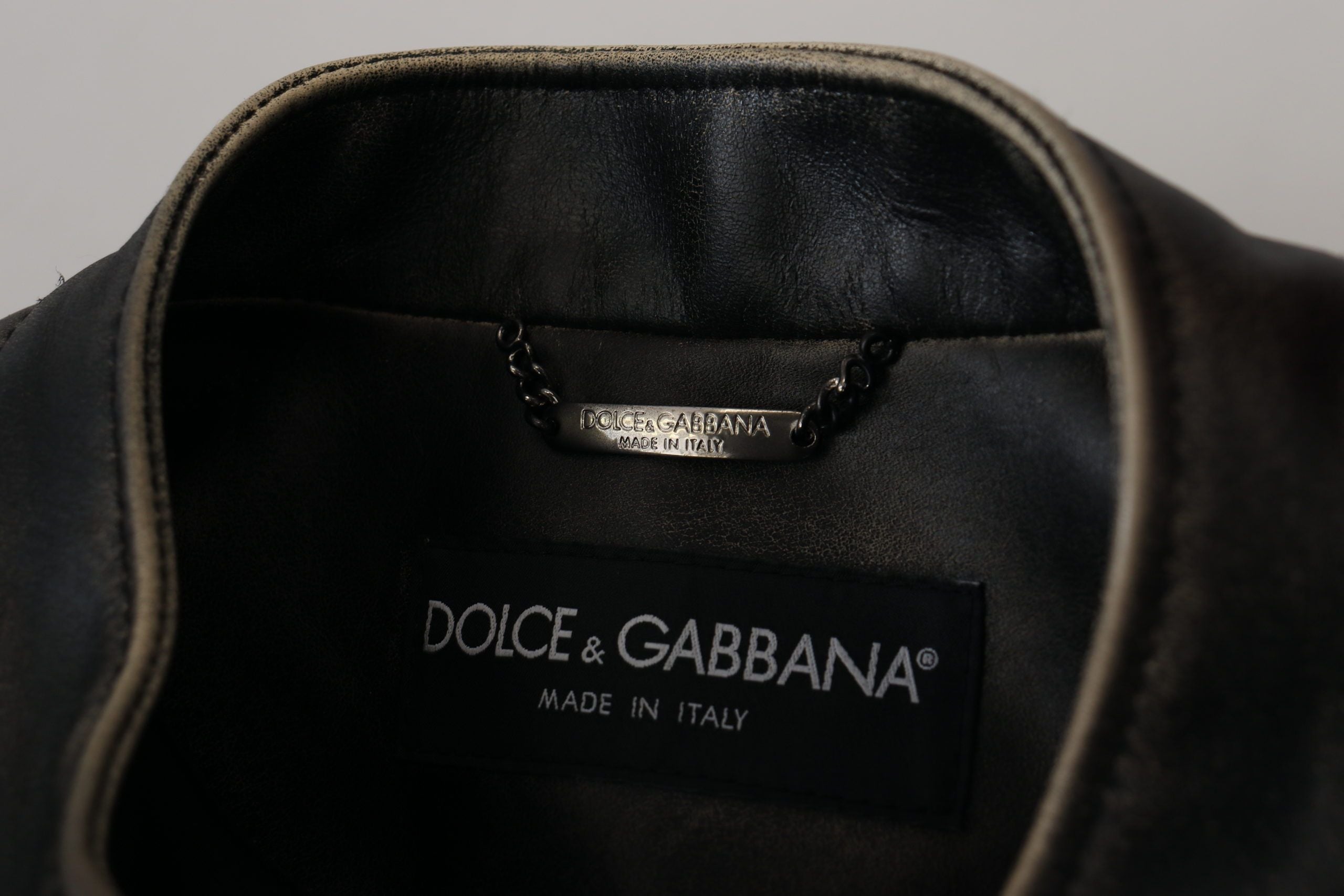 Indulge in the exquisite Dolce & Gabbana Black Leather Zipper Biker Coat Jacket, a luxurious statement of Italian craftsmanship and timeless elegance.