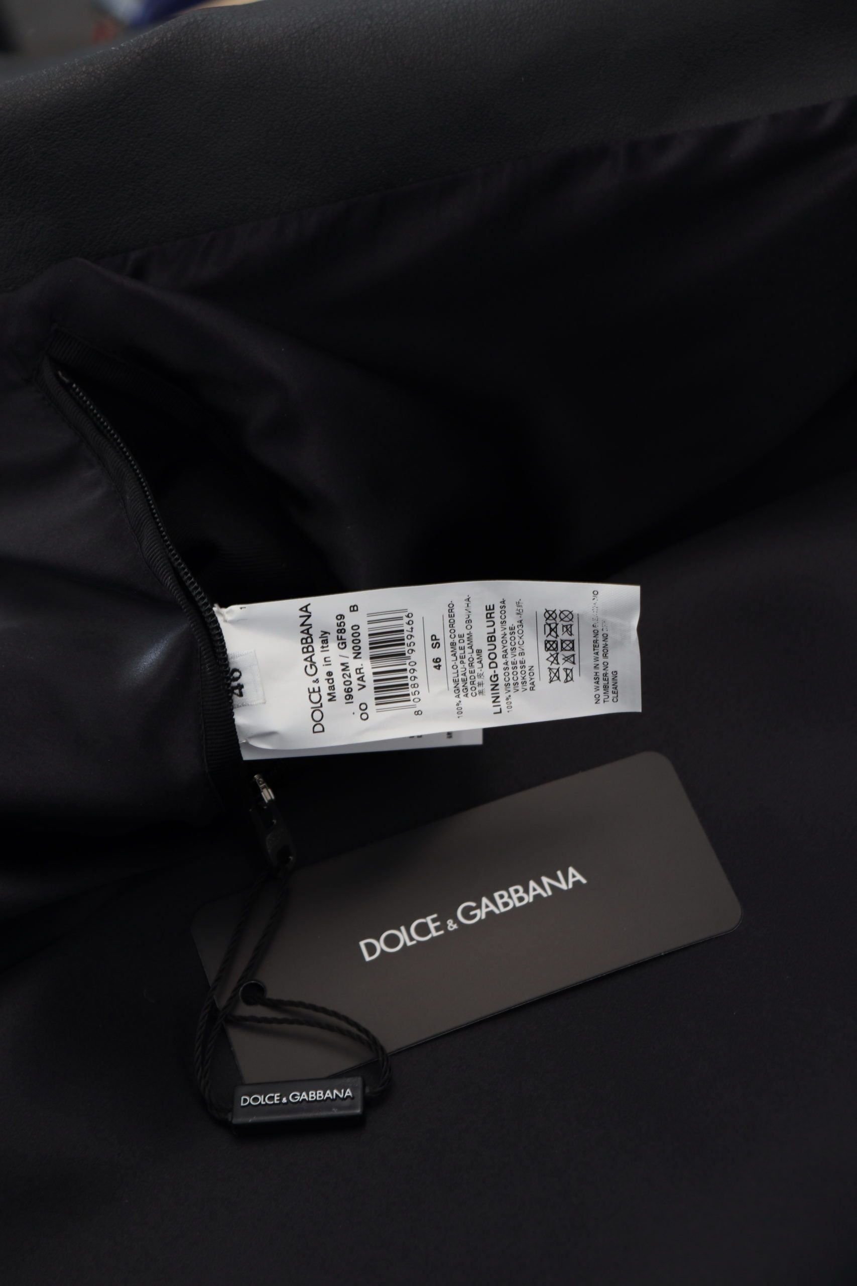 Indulge in the exquisite Dolce & Gabbana Black Leather Biker Coat, a masterpiece of Italian craftsmanship that elevates your style with timeless elegance and luxurious allure.