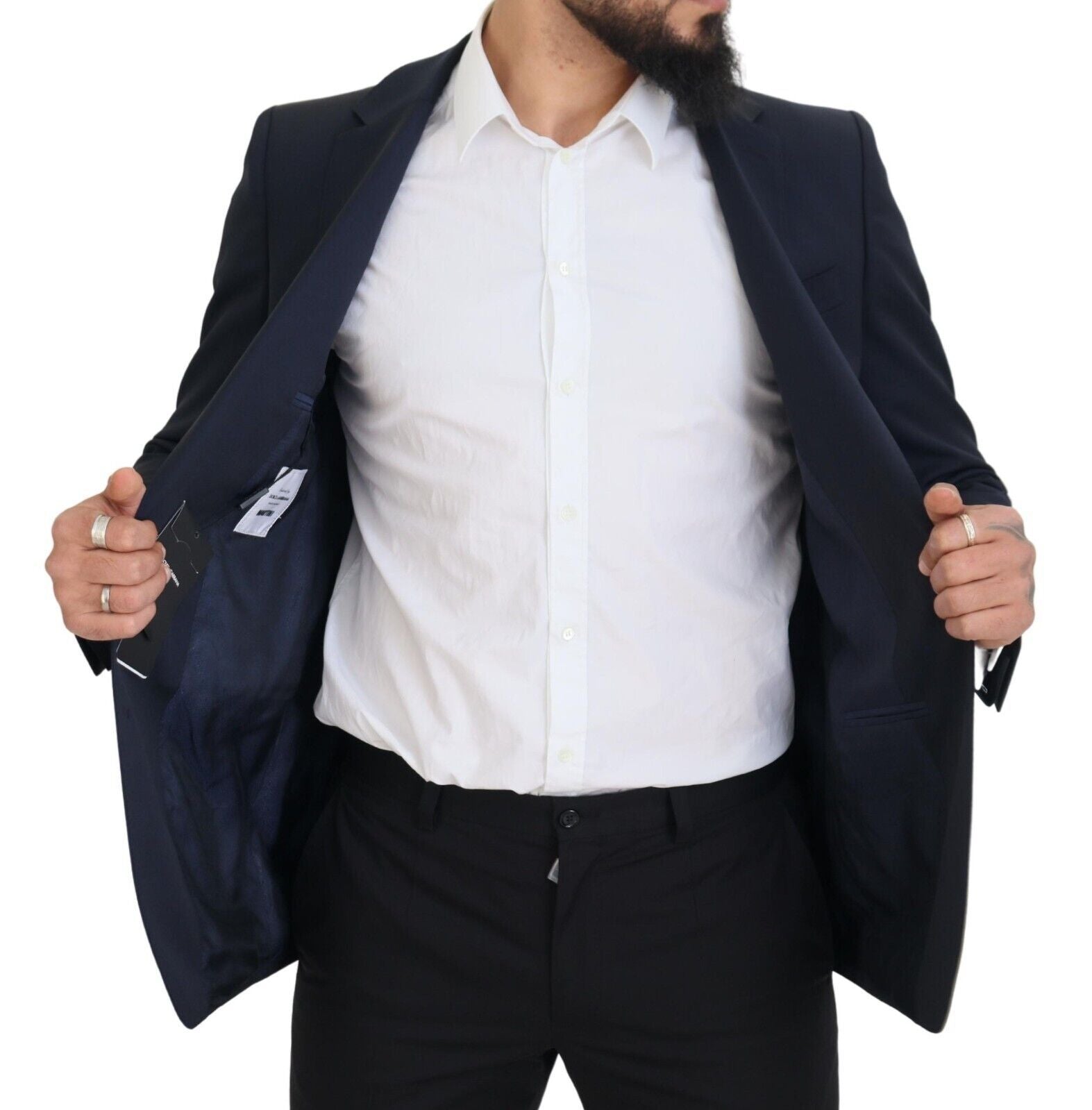 Elevate your wardrobe with the Dolce & Gabbana Dark Blue Wool MARTINI Blazer, a luxurious blend of virgin wool and elastane, crafted in Italy for timeless sophistication.