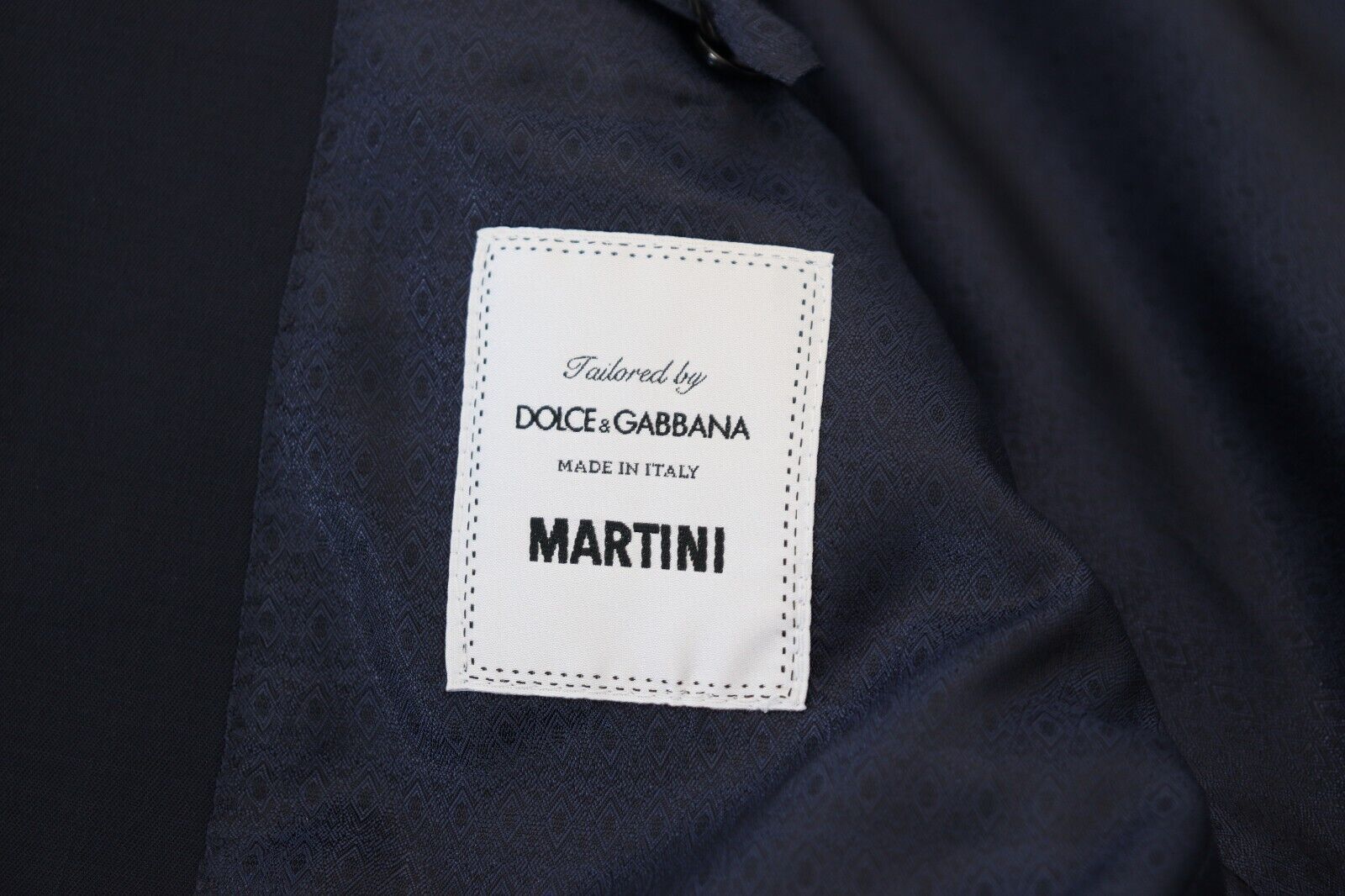 Indulge in the exquisite Dolce & Gabbana Dark Blue Wool MARTINI Blazer, a masterpiece of Italian craftsmanship that embodies timeless elegance and sophisticated allure.