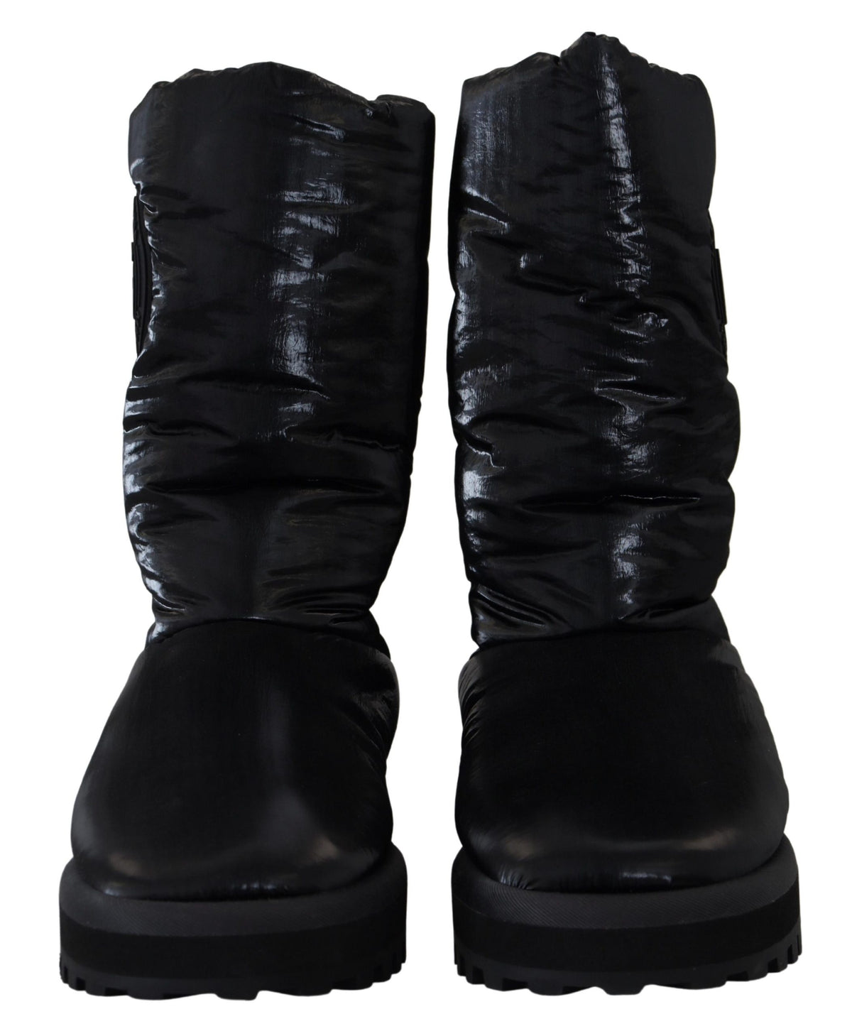 Elevate your winter wardrobe with Dolce & Gabbana's Black Padded Mid Calf Boots, crafted in Italy from luxurious polyester, blending sophistication and comfort for the discerning individual.