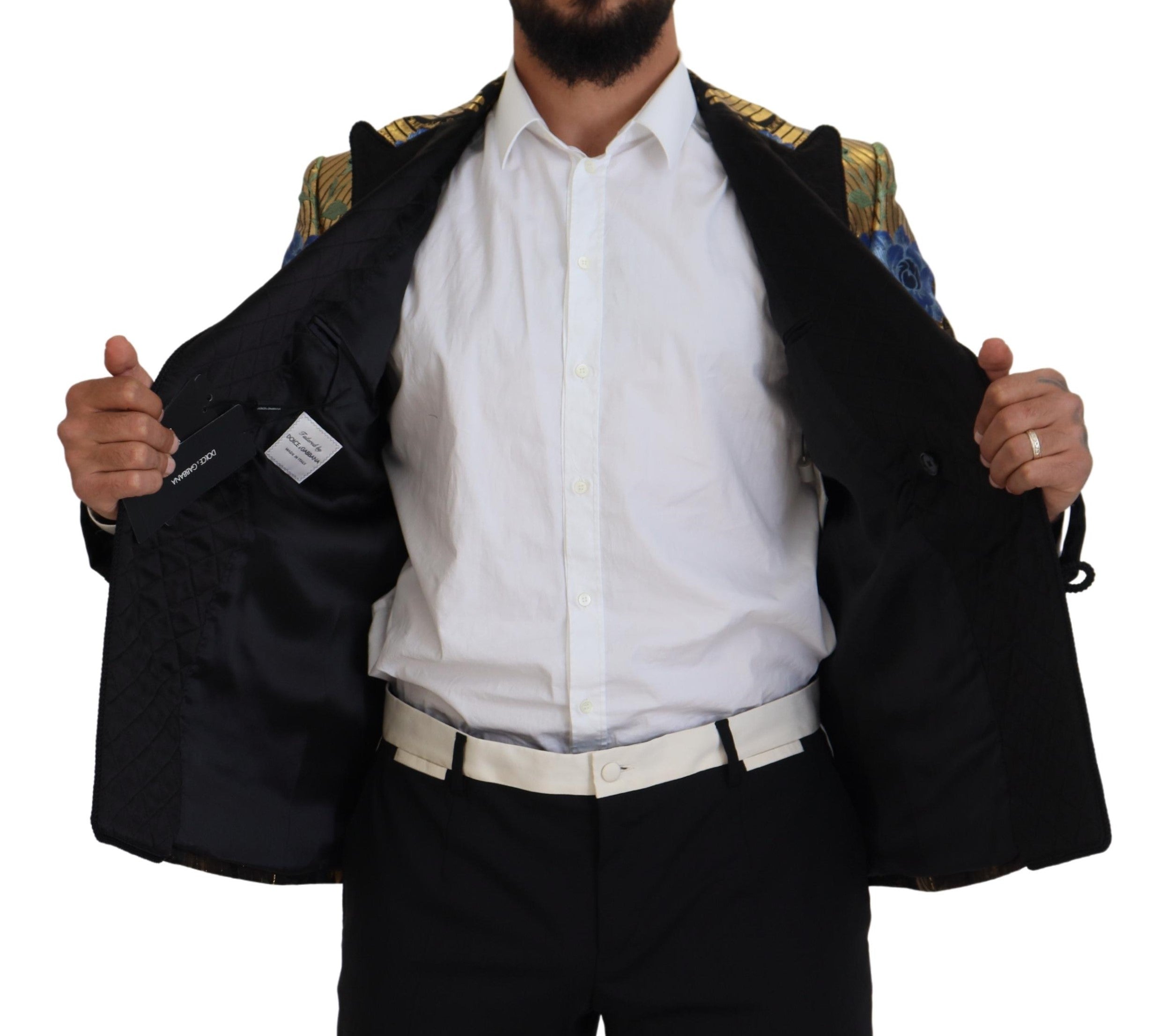Indulge in the Dolce & Gabbana Gold Lurex Double Breasted Jacket Blazer, a masterpiece of Italian craftsmanship that redefines luxury and sophistication for the discerning connoisseur.