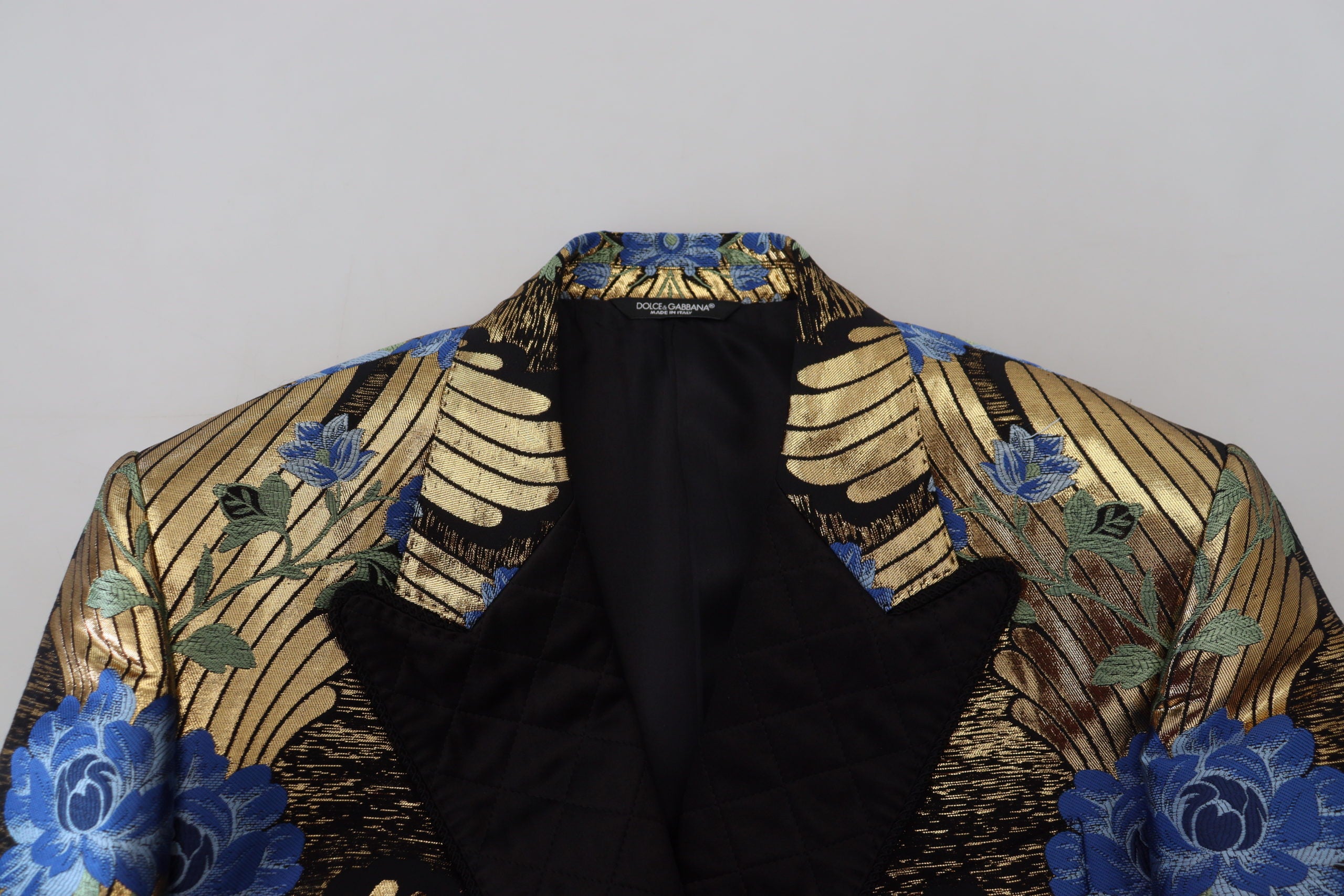 Indulge in the Dolce & Gabbana Gold Lurex Double Breasted Jacket Blazer, a masterpiece of Italian craftsmanship that embodies opulence, sophistication, and timeless elegance.