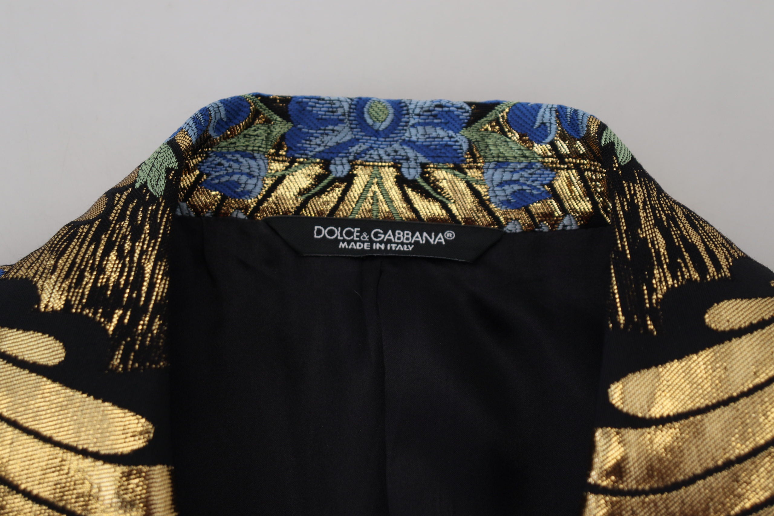 Indulge in the exquisite Dolce & Gabbana Gold Lurex Double Breasted Jacket Blazer, where luxurious Italian craftsmanship meets timeless elegance, perfect for the discerning connoisseur.