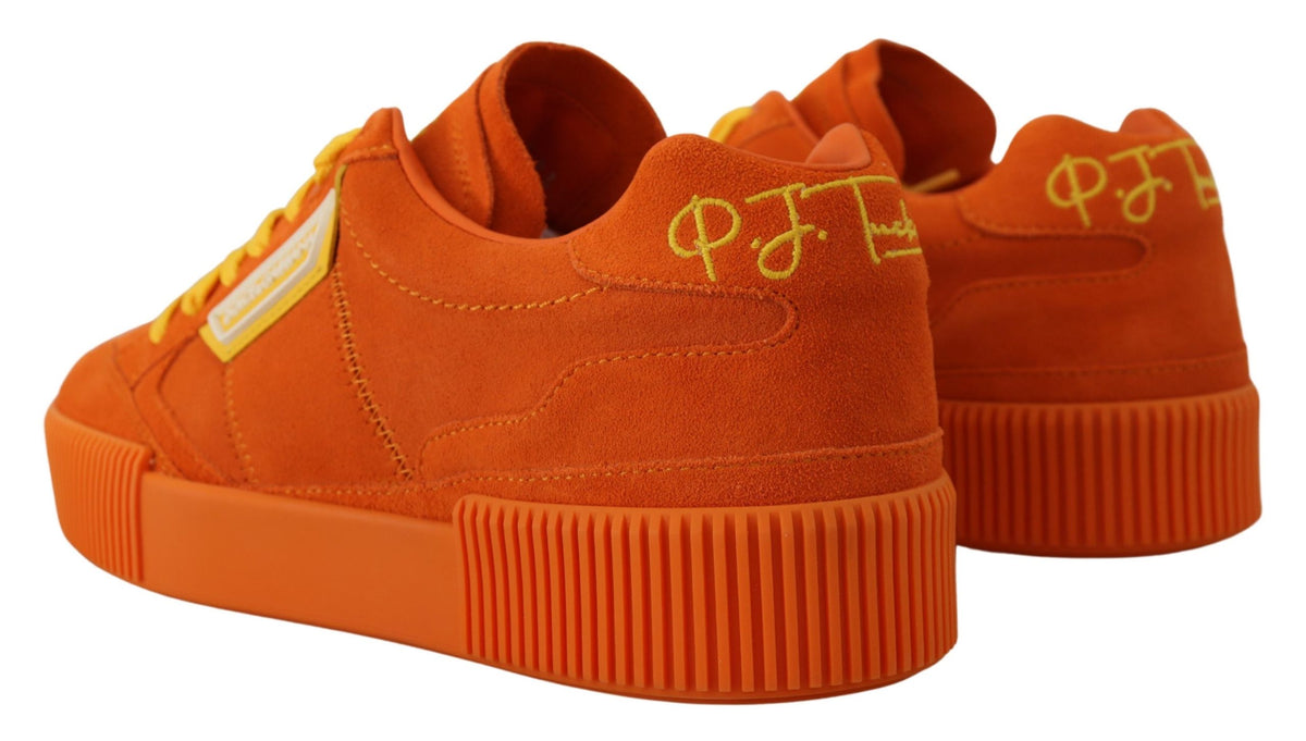 Indulge in the exquisite Dolce & Gabbana Orange Leather P.J. Tucker Sneakers, where luxurious Italian craftsmanship meets bold elegance, elevating your style to new heights.
