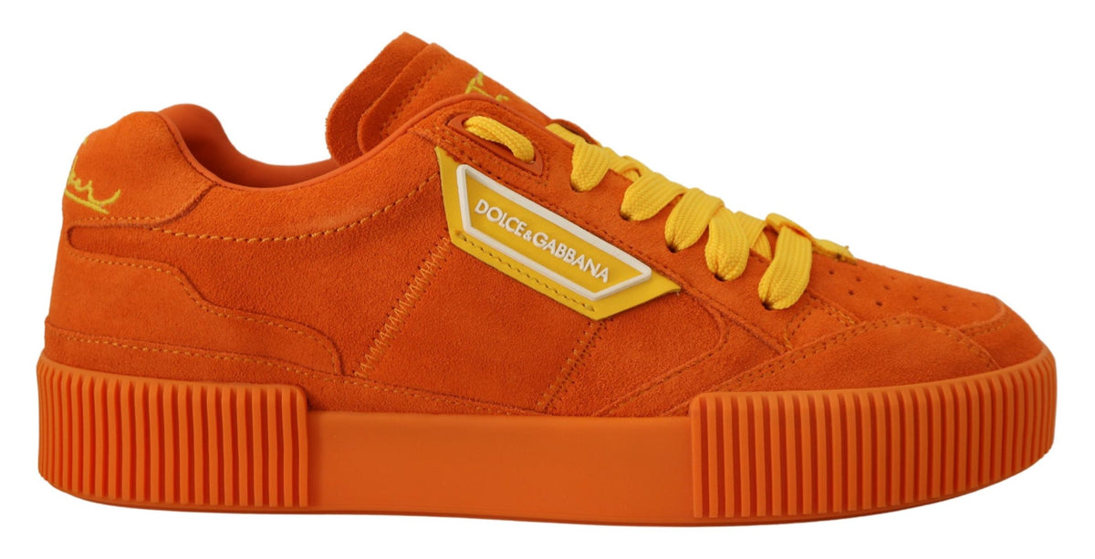 Indulge in the exquisite craftsmanship of Dolce & Gabbana's Orange Leather P.J. Tucker Sneakers, where vibrant luxury meets timeless elegance for the discerning individual.