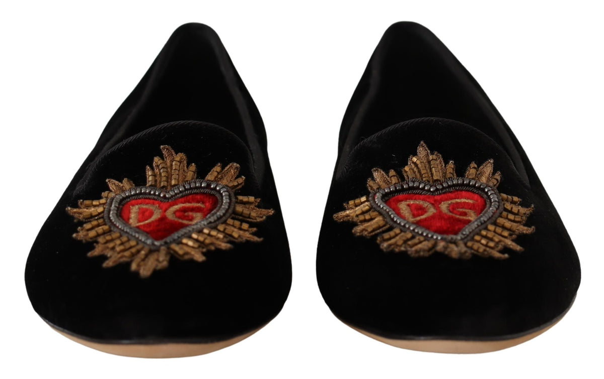 Experience the allure of Dolce & Gabbana's Black DG Sacred Heart Patch Slip On Flats, crafted from luxurious leather for timeless elegance and effortless sophistication.