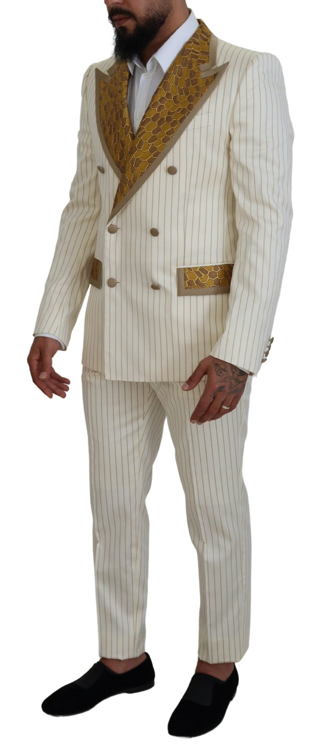 Elevate your elegance with the Dolce & Gabbana Off White Gold Striped Tuxedo Slim Fit Suit, a masterpiece of Italian craftsmanship designed for those who embody sophistication and allure.