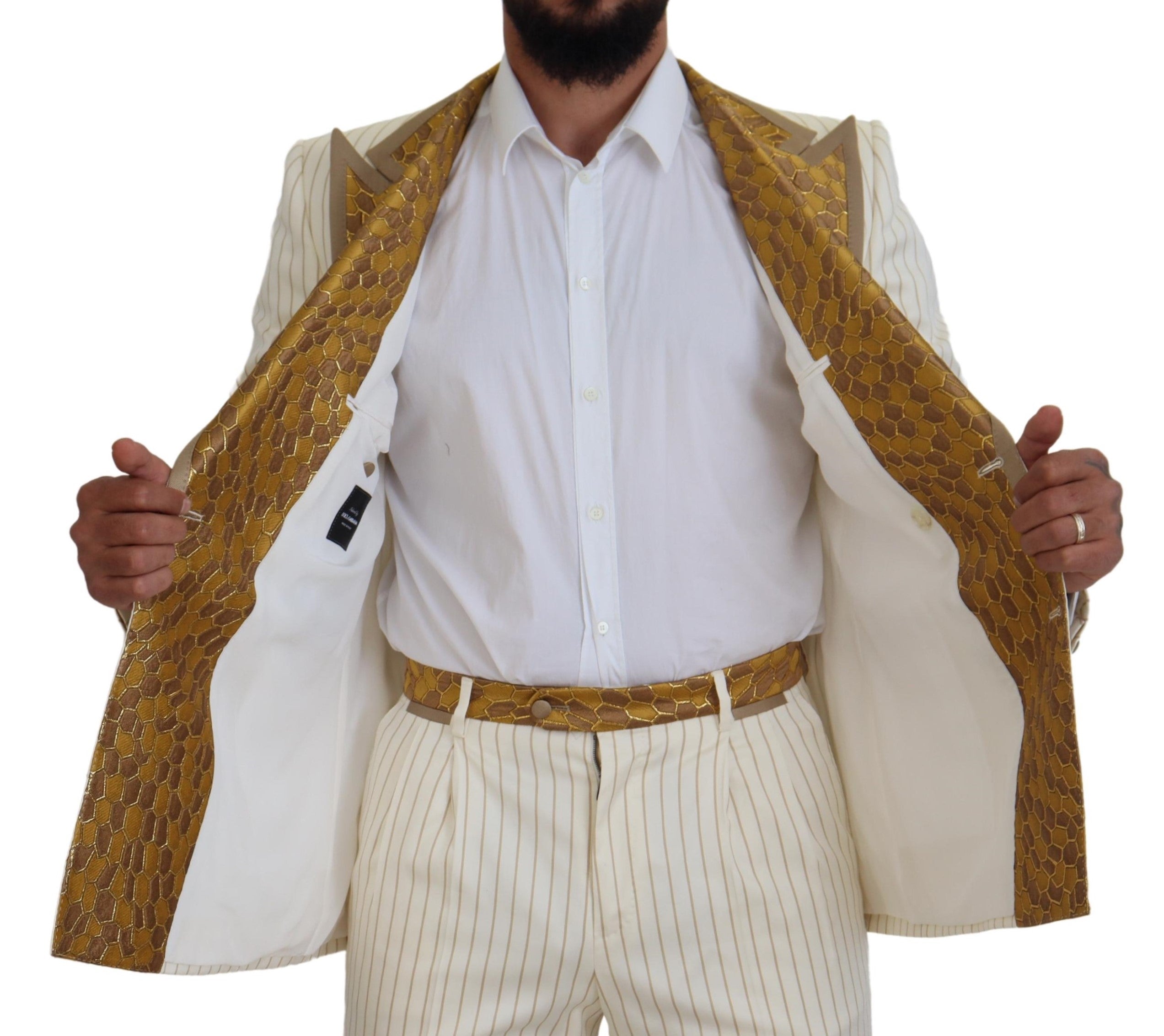 Experience the allure of Dolce & Gabbana's Off White Gold Striped Tuxedo Slim Fit Suit, where exquisite craftsmanship meets luxurious materials for a statement of elegance.