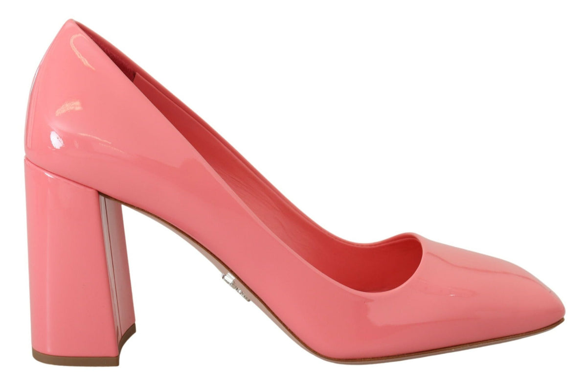 Experience the allure of Prada Pink Patent Leather Block Heels, where exquisite craftsmanship meets timeless elegance, perfect for the discerning individual.