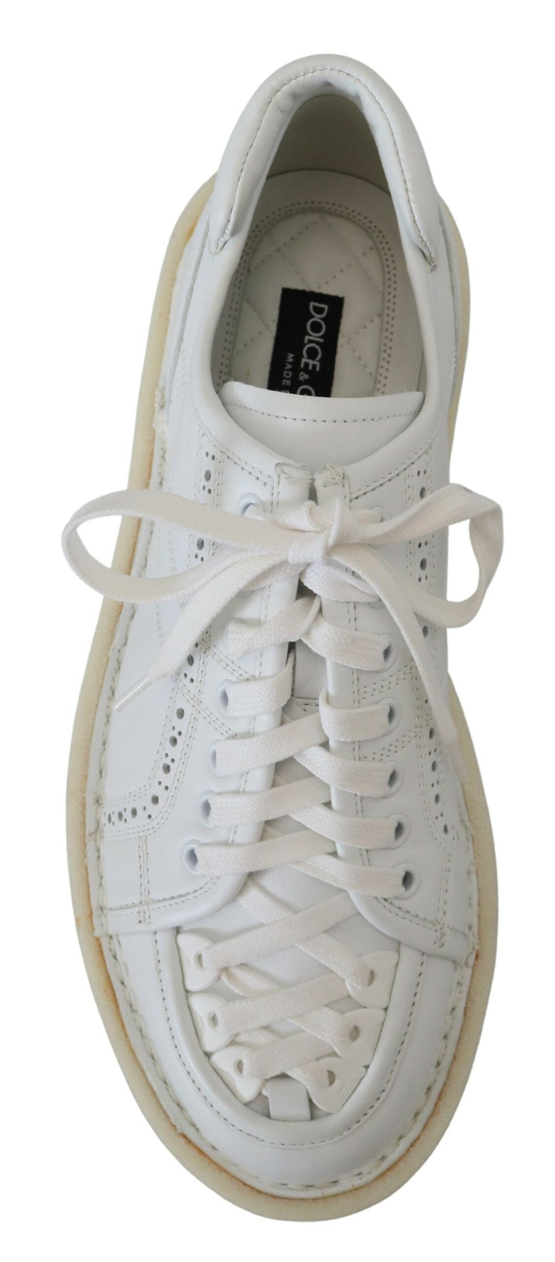 Elevate your style with Dolce & Gabbana White Leather Low Top Oxford Sneakers, crafted from premium leather in Italy, merging luxury with effortless sophistication.
