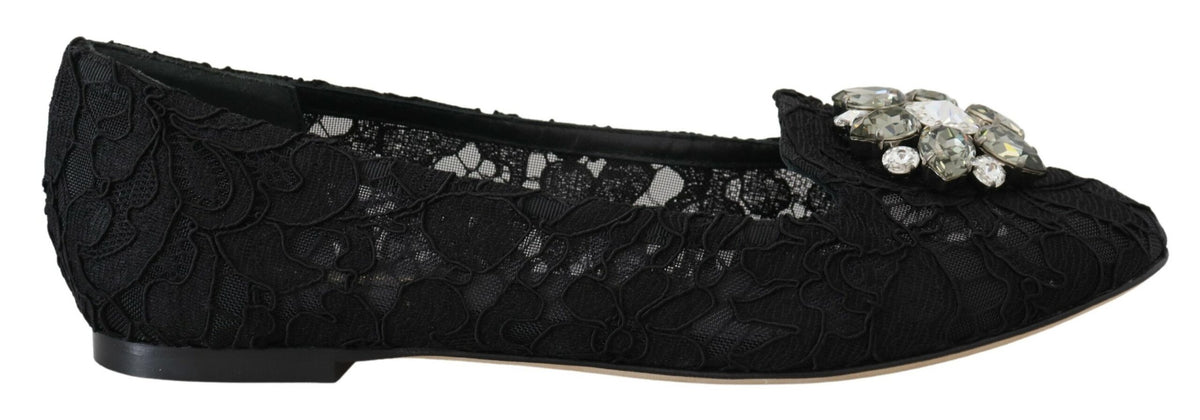Indulge in the exquisite allure of Dolce & Gabbana's Black Taormina Lace Crystals Flats, where artisanal craftsmanship meets timeless elegance for the discerning individual.