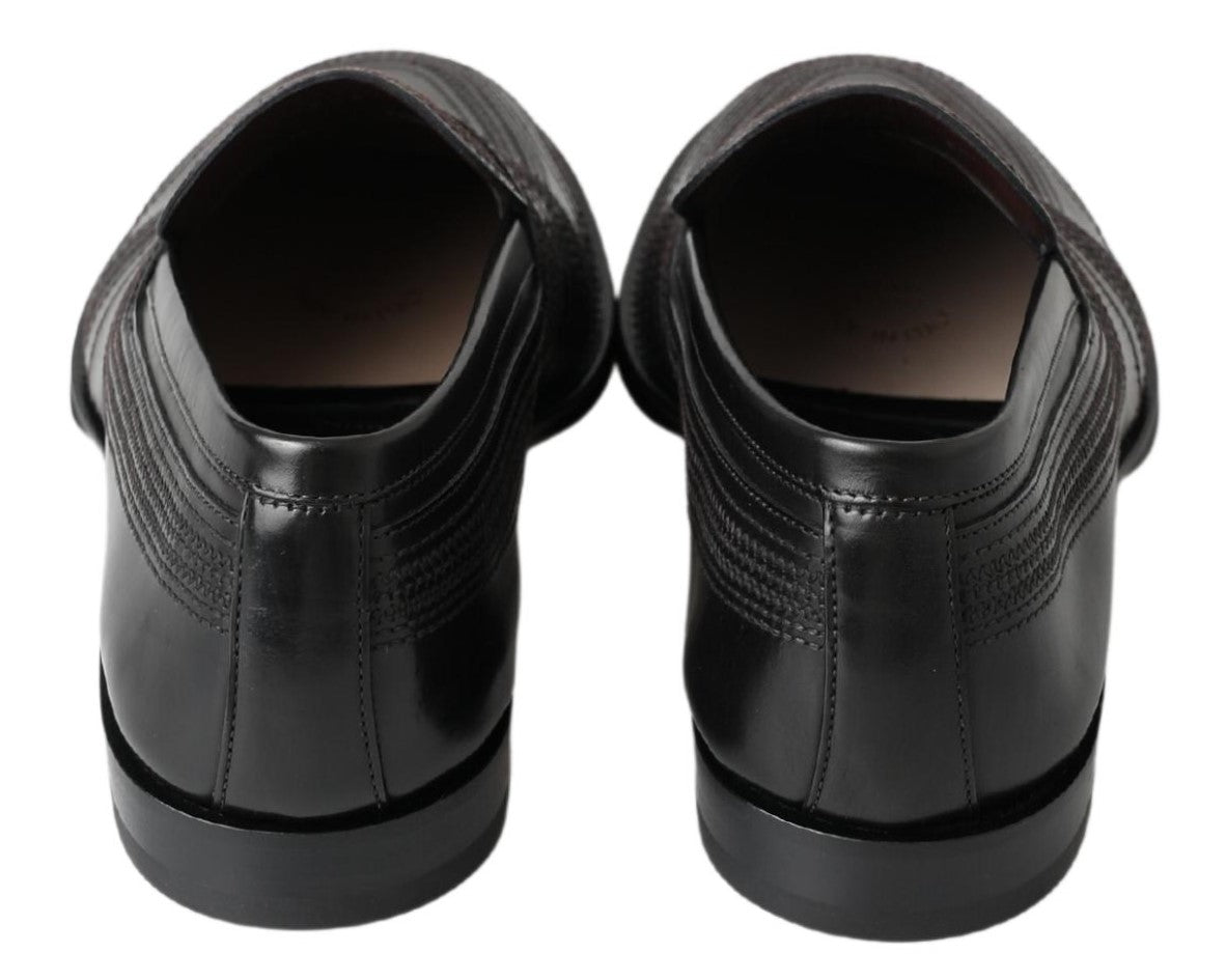 Elevate your elegance with Dolce & Gabbana Black Leather Slipper Loafers, handcrafted in Italy from sumptuous leather, embodying timeless luxury and exquisite artistry.