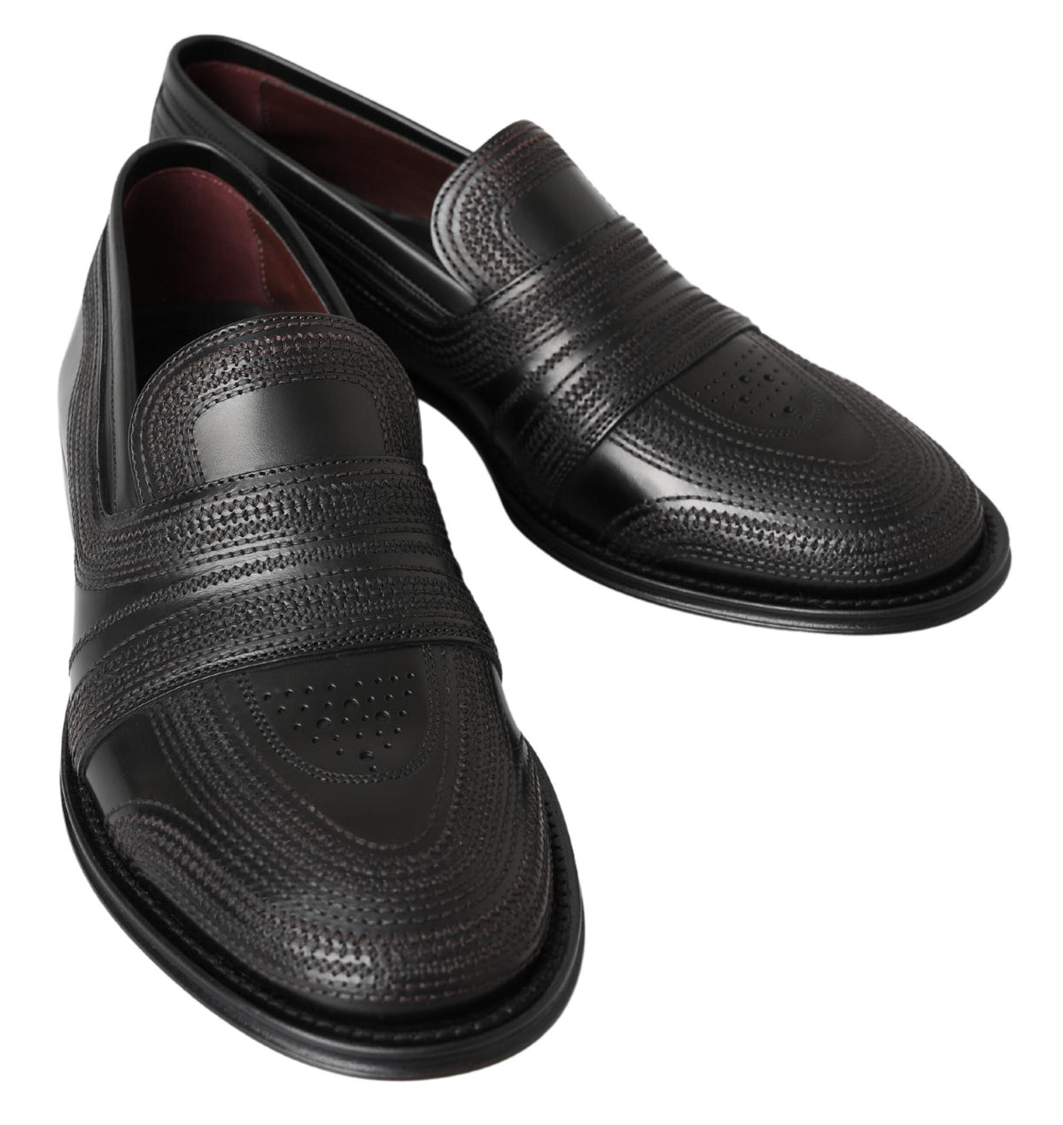 Indulge in the exquisite craftsmanship of Dolce & Gabbana Black Leather Slipper Loafers, where timeless design meets luxurious comfort for the discerning individual.