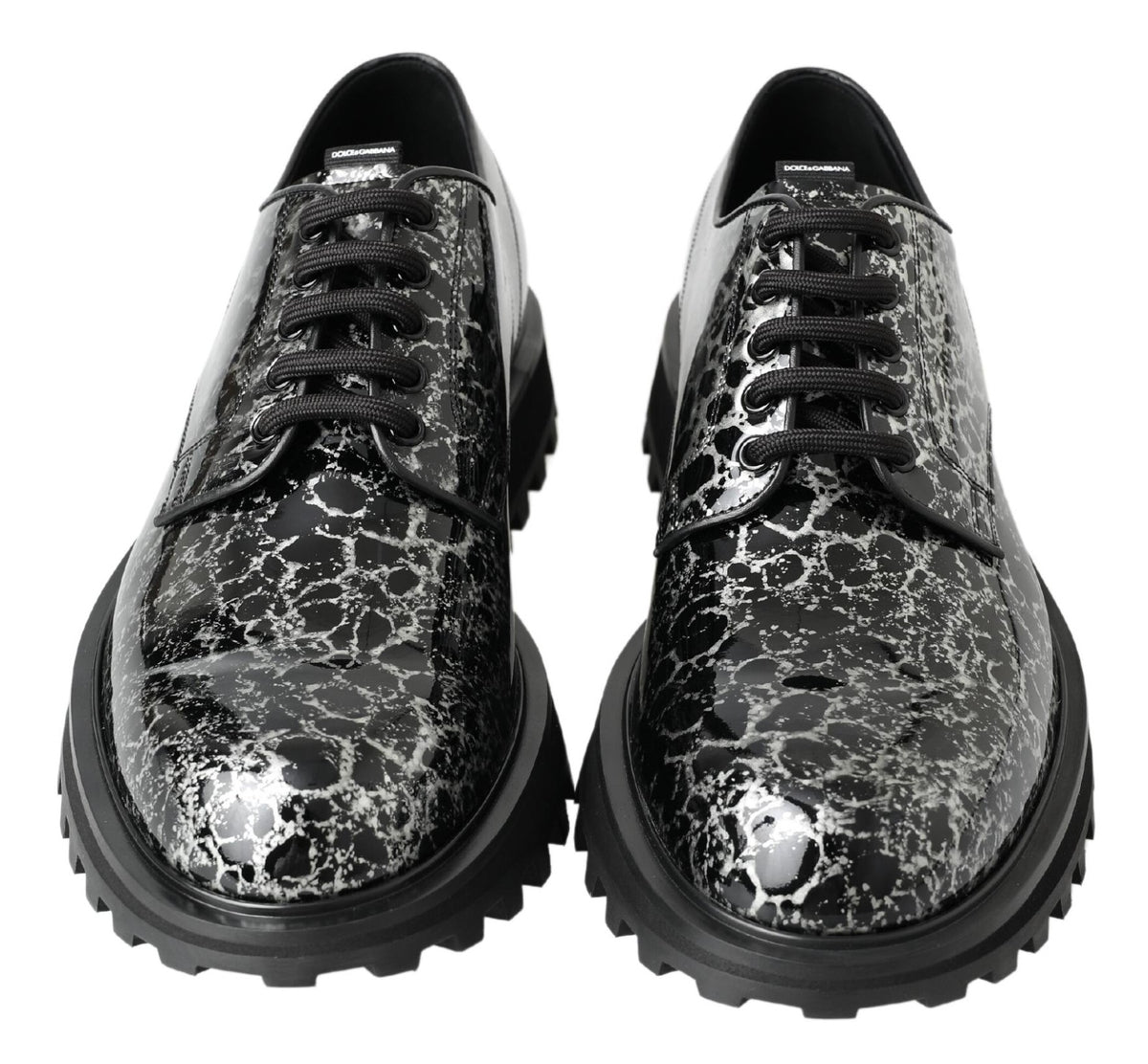 Elevate your style with Dolce & Gabbana's Black White Derby Patent Leather Shoes, where exquisite Italian craftsmanship meets luxurious design for the discerning connoisseur.