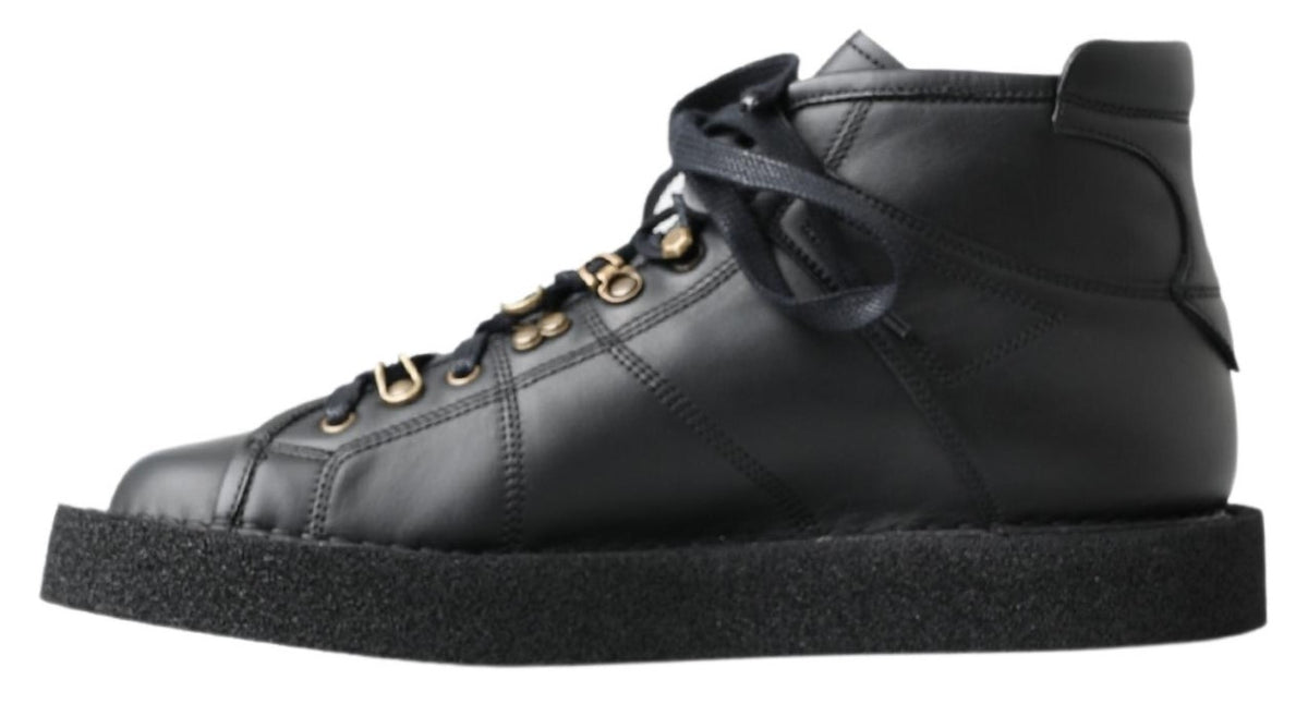 Elevate your style with Dolce & Gabbana's Black Leather Slip-on Stretch Boots, handcrafted in Italy for unparalleled elegance and effortless sophistication.