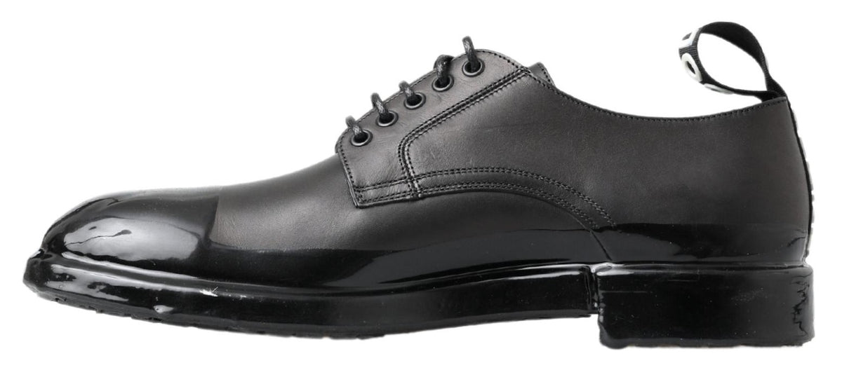 Elevate your style with Dolce & Gabbana's Black Leather Derby Dress Shoes, where exquisite craftsmanship meets timeless luxury, perfect for any sophisticated occasion.