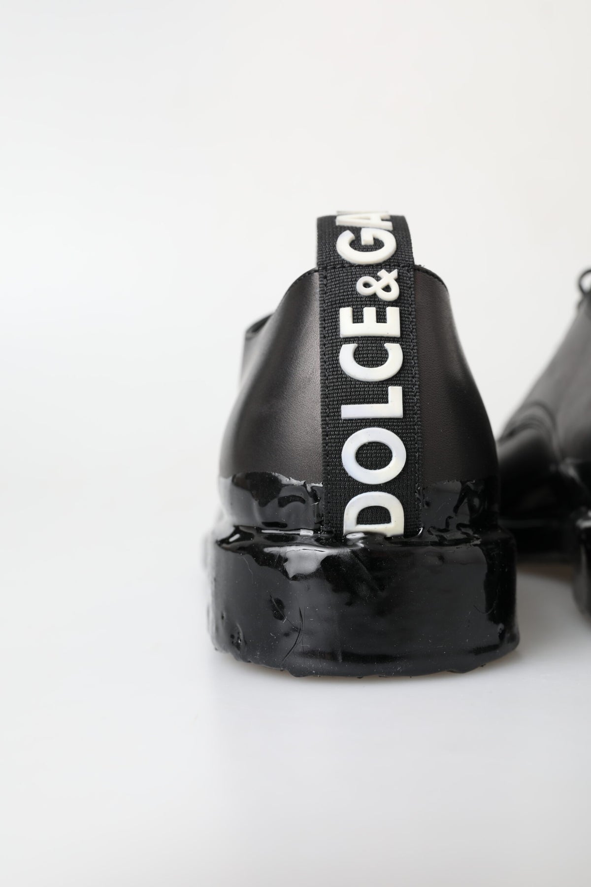 Experience the exquisite craftsmanship of Dolce & Gabbana's Black Leather Derby Dress Shoes, where timeless luxury meets modern sophistication for every occasion.