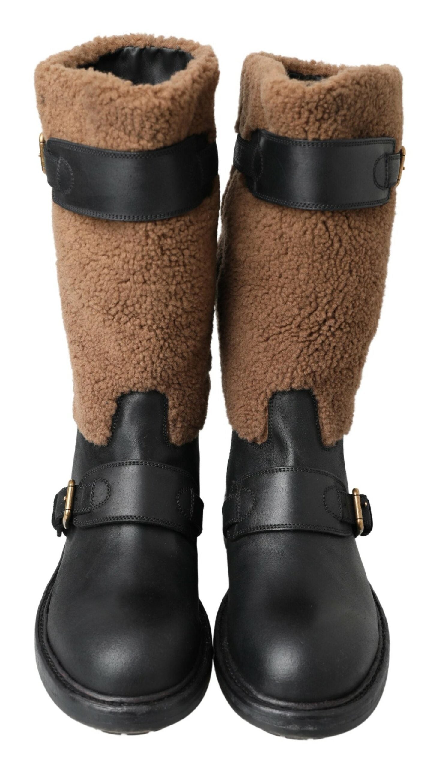 Indulge in the exquisite Dolce & Gabbana Black Leather Brown Shearling Boots, a masterpiece of Italian craftsmanship that elevates your winter style with luxurious materials and timeless design.