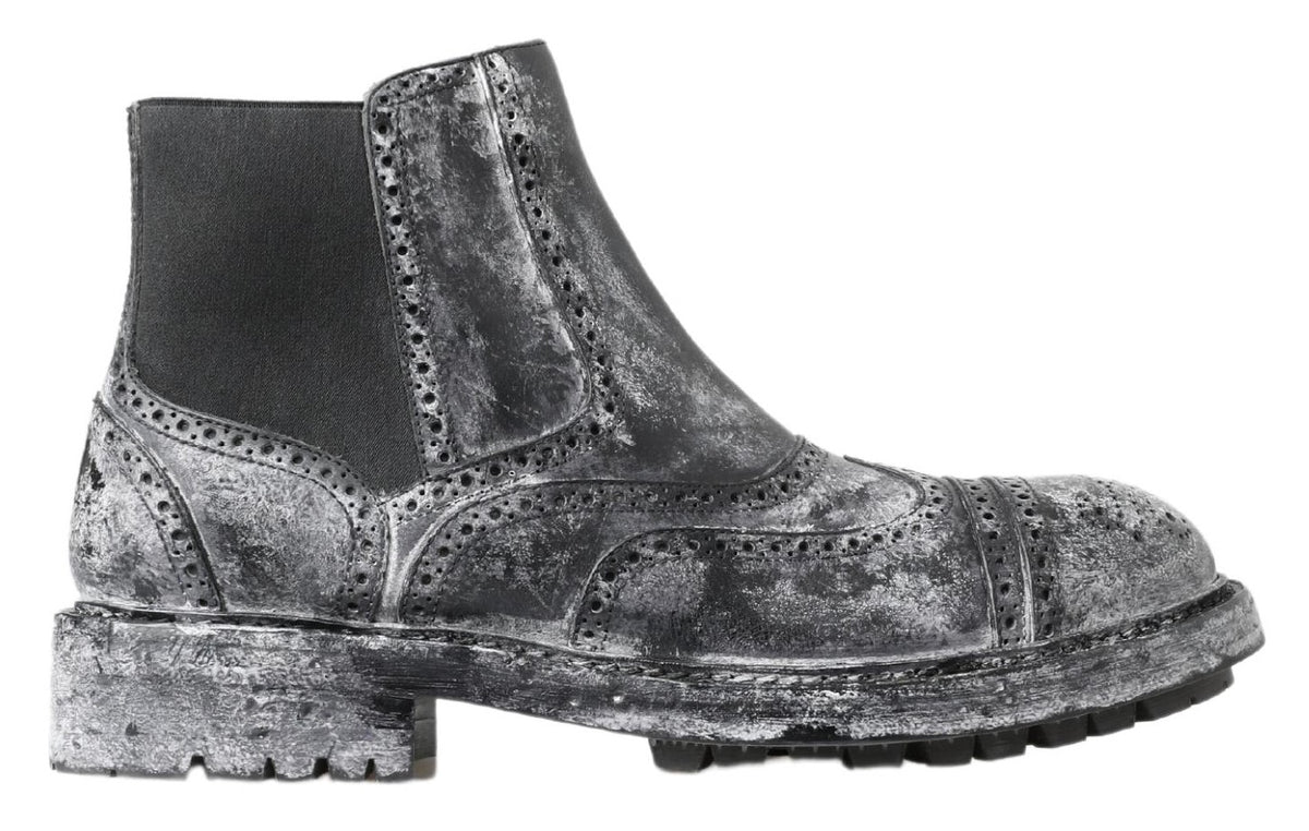 Elevate your style with Dolce & Gabbana Black Gray Leather Ankle Boots, where exquisite Italian craftsmanship meets luxurious design, perfect for the discerning individual.