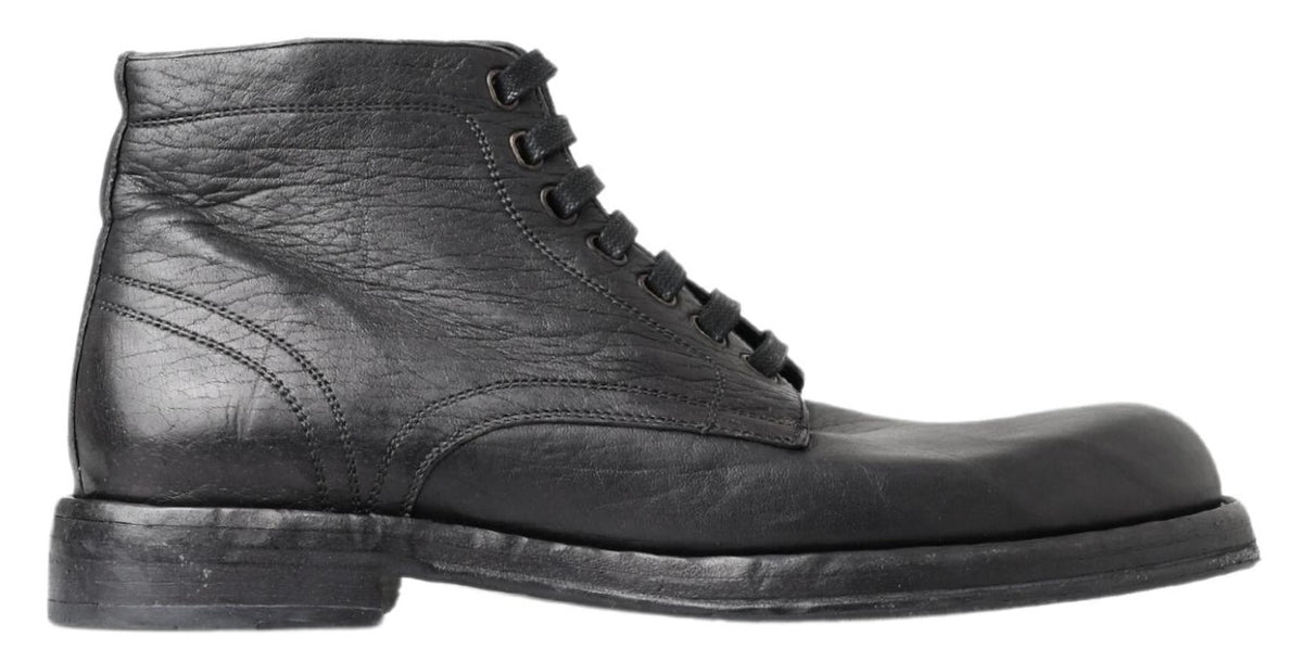 Indulge in the exquisite Dolce & Gabbana Black Horse Leather Perugino Boots, where Italian craftsmanship meets refined elegance for the discerning gentleman.