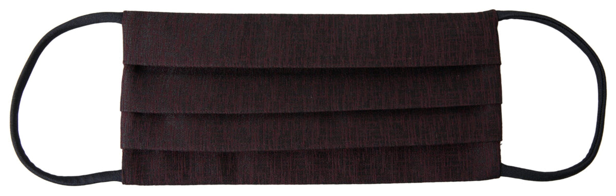 Discover the Dolce & Gabbana Maroon Pleated Elastic Ear Strap Face Mask, a symbol of sophistication and elegance, merging luxury with essential style for the discerning individual.