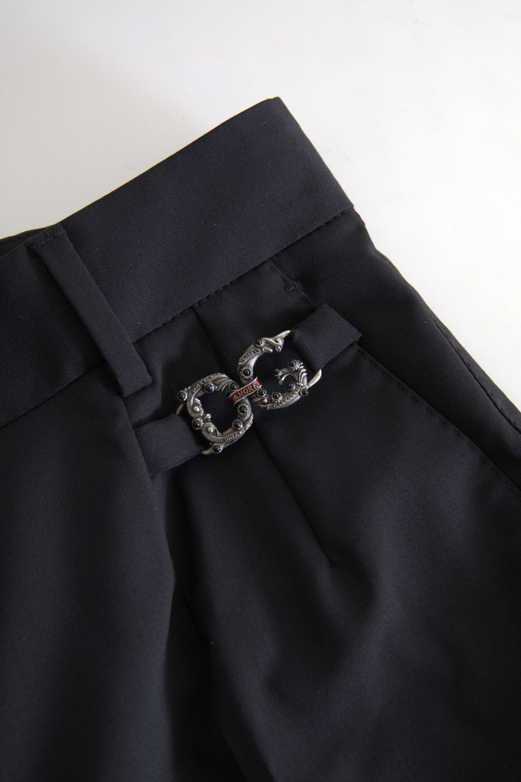 Discover the Dolce & Gabbana Black Wool High Waist Tapered Pants, a symbol of luxury crafted from exquisite virgin wool, embodying timeless elegance and unparalleled craftsmanship.