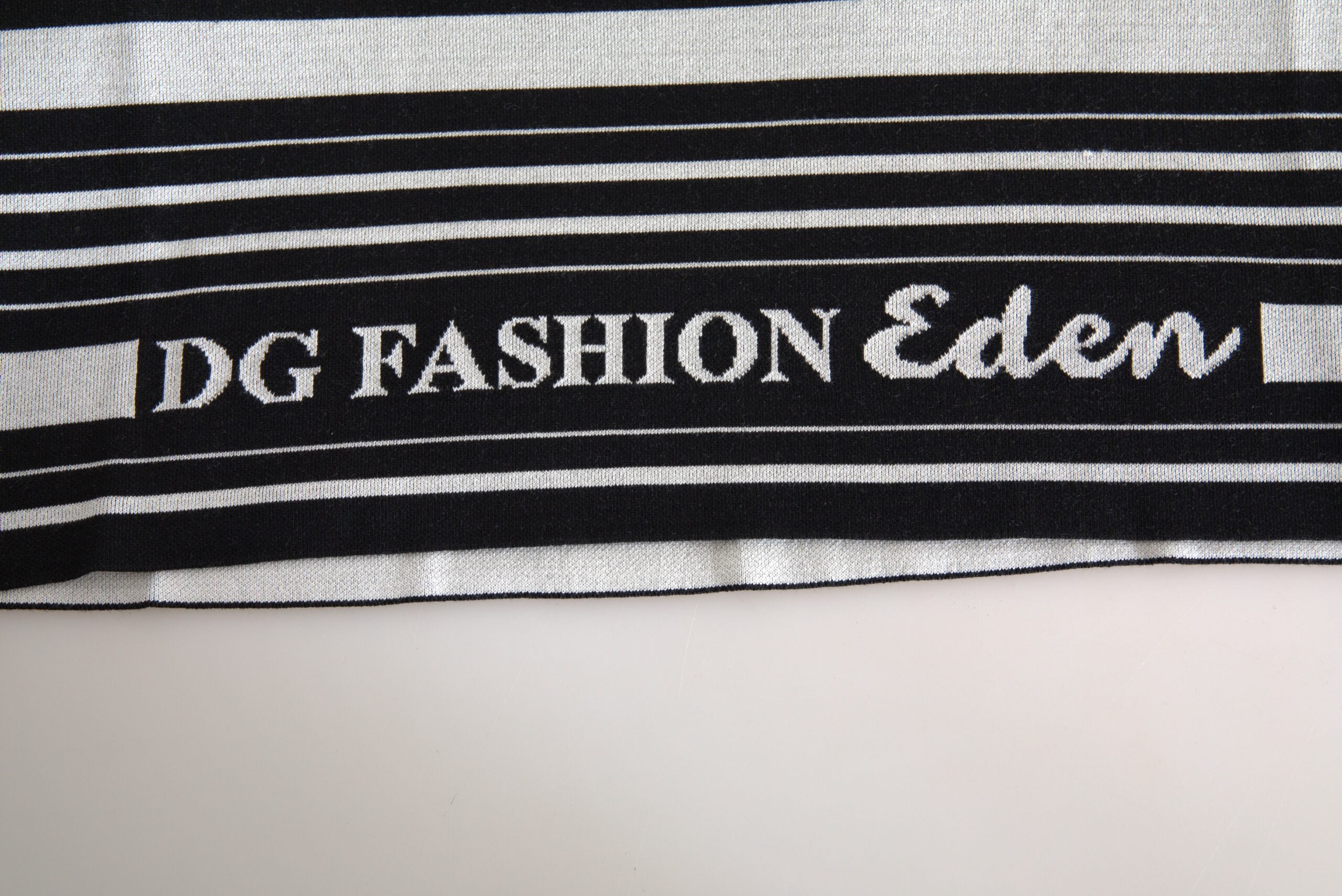 Indulge in the Dolce & Gabbana White Cotton DG Fashion Crew Neck Tee, where exquisite Italian craftsmanship meets timeless elegance for the discerning individual.