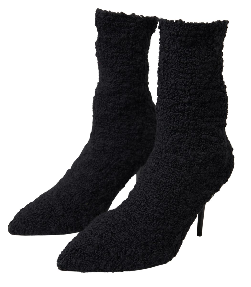 Indulge in the exquisite allure of Dolce & Gabbana Black Stiletto Heels Mid Calf Boots, crafted from premium virgin wool, embodying timeless elegance and unparalleled luxury.