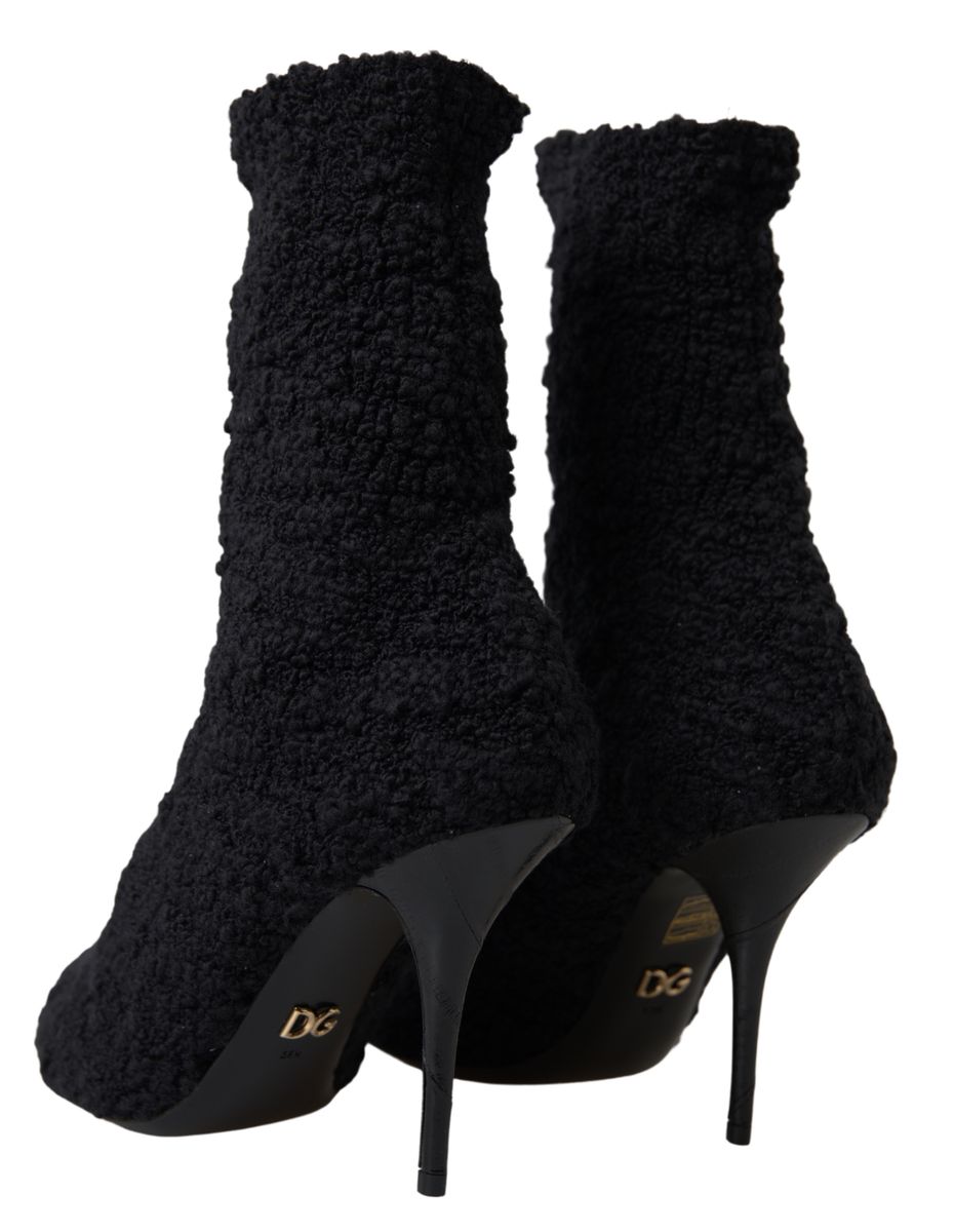 Elevate your style with Dolce & Gabbana Black Stiletto Heels Mid Calf Boots, crafted from premium virgin wool, embodying timeless luxury and exquisite Italian craftsmanship.