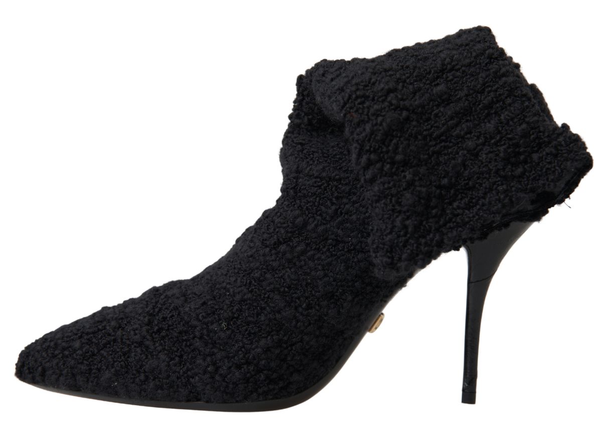 Step into the realm of luxury with Dolce & Gabbana Black Stiletto Heels Mid Calf Boots, crafted from premium virgin wool, exuding timeless elegance and unparalleled craftsmanship.