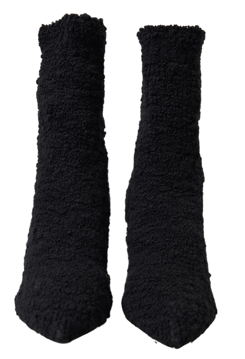 Indulge in the exquisite allure of Dolce & Gabbana Black Stiletto Heels Mid Calf Boots, crafted from premium virgin wool, embodying timeless luxury and sophistication.