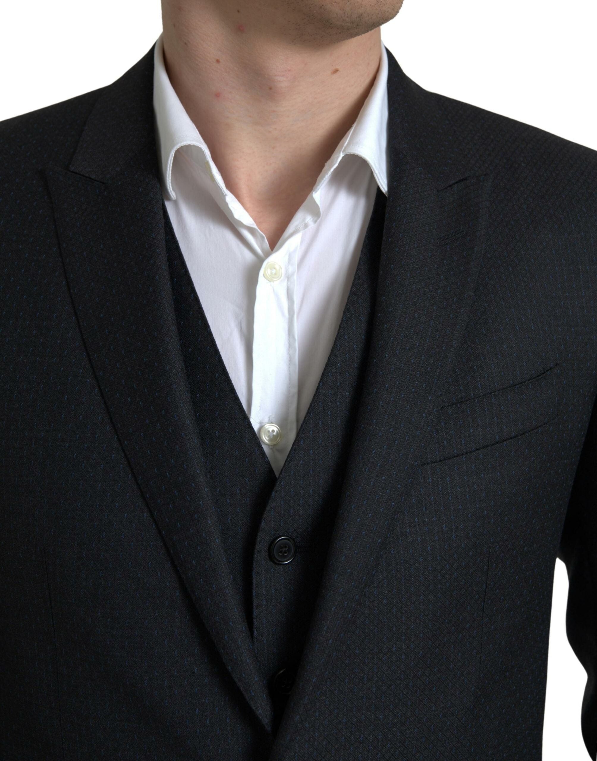 Discover the Dolce & Gabbana Black MARTINI Suit, a masterpiece of 100% Virgin Wool, embodying exquisite craftsmanship and timeless elegance for the discerning individual.
