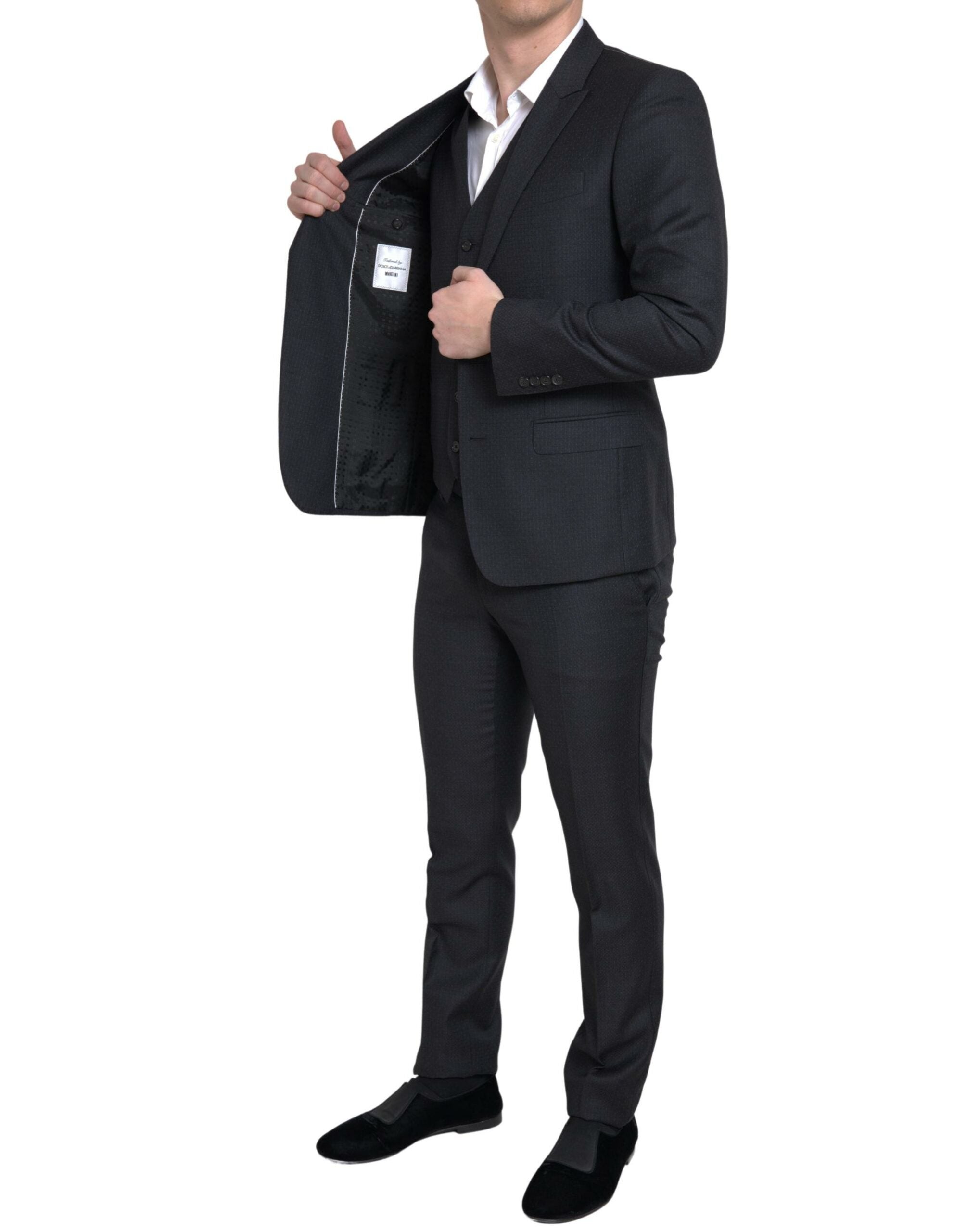 Discover the Dolce & Gabbana Black MARTINI Suit, an exquisite blend of 100% Virgin Wool and artisanal craftsmanship, embodying timeless elegance for the discerning individual.