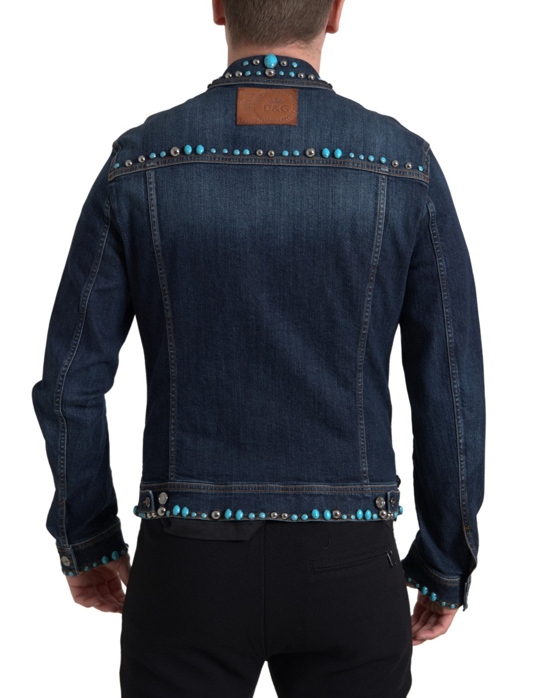 Indulge in the exquisite Dolce & Gabbana Blue Denim Turquoise Stones Studded Jacket, where luxurious craftsmanship meets iconic design, embodying timeless elegance and individuality.