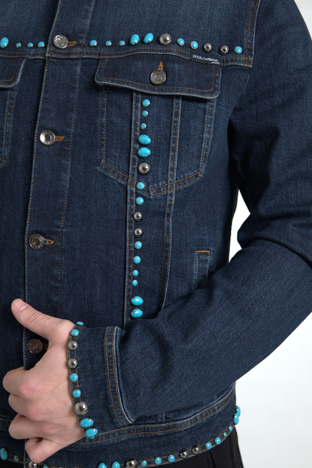 Indulge in the exquisite Dolce & Gabbana Blue Denim Turquoise Stones Studded Jacket, where luxurious craftsmanship meets iconic design, elevating your style to new heights.