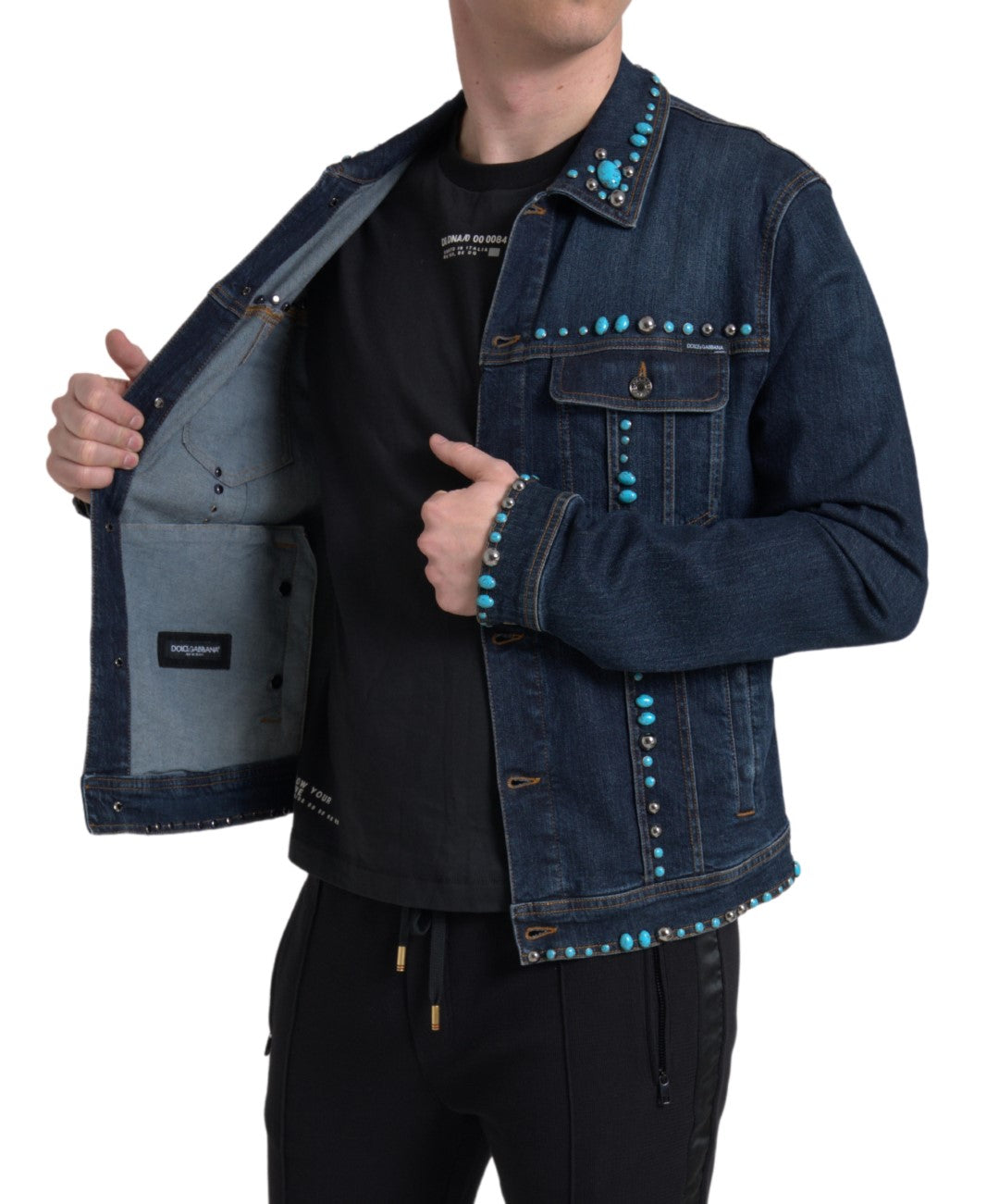 Indulge in the exquisite Dolce & Gabbana Blue Denim Turquoise Stones Studded Jacket, where luxurious craftsmanship meets iconic design, embodying timeless elegance and individuality.