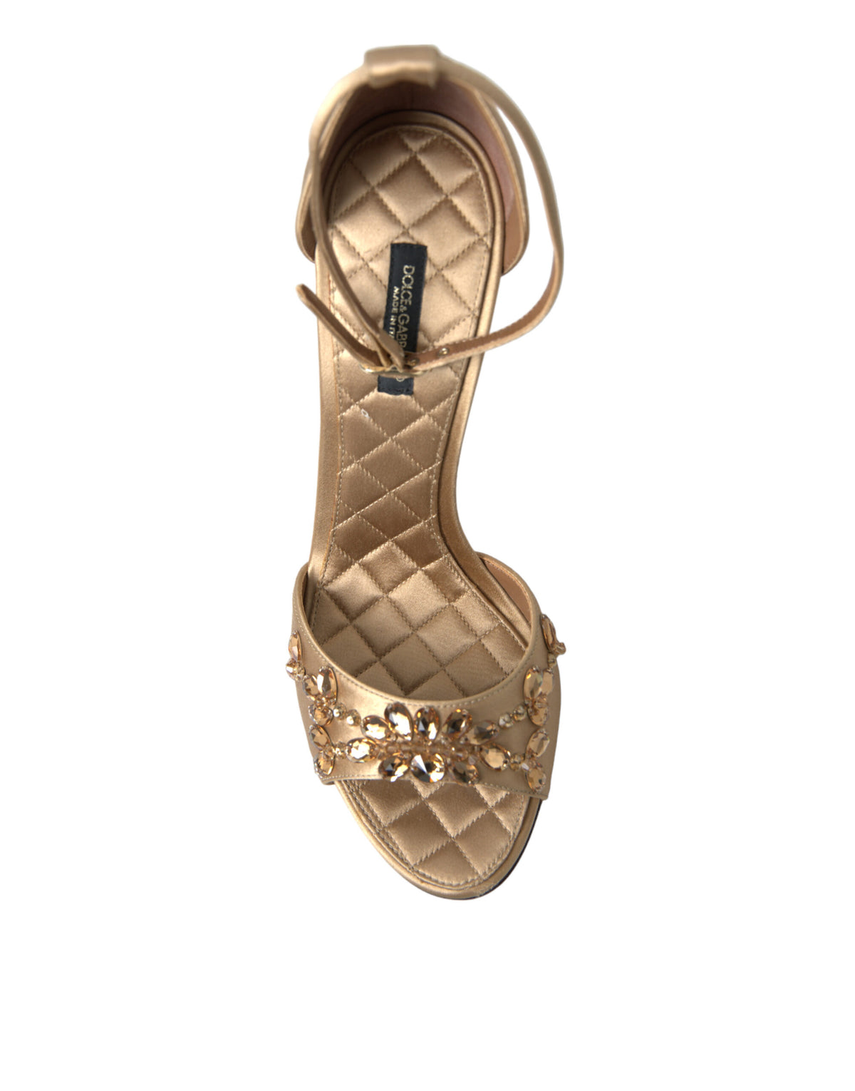 Indulge in the exquisite craftsmanship of Dolce & Gabbana's Gold Satin Ankle Strap Crystal Sandals, where luxurious silk and viscose meet timeless elegance for unforgettable moments.