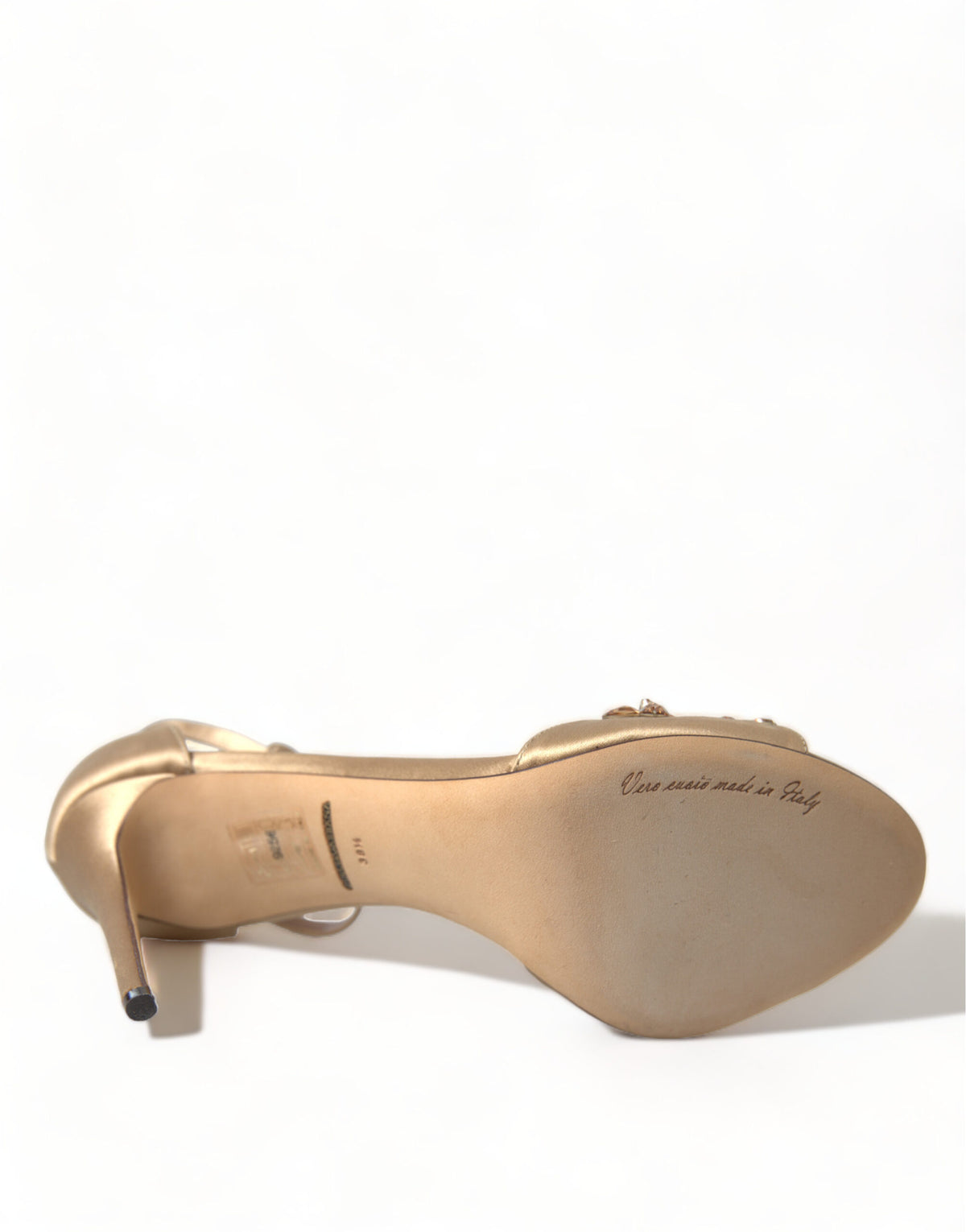 Indulge in the exquisite Dolce & Gabbana Gold Satin Ankle Strap Crystal Sandals, where luxurious silk and viscose meet Italian craftsmanship for timeless elegance.