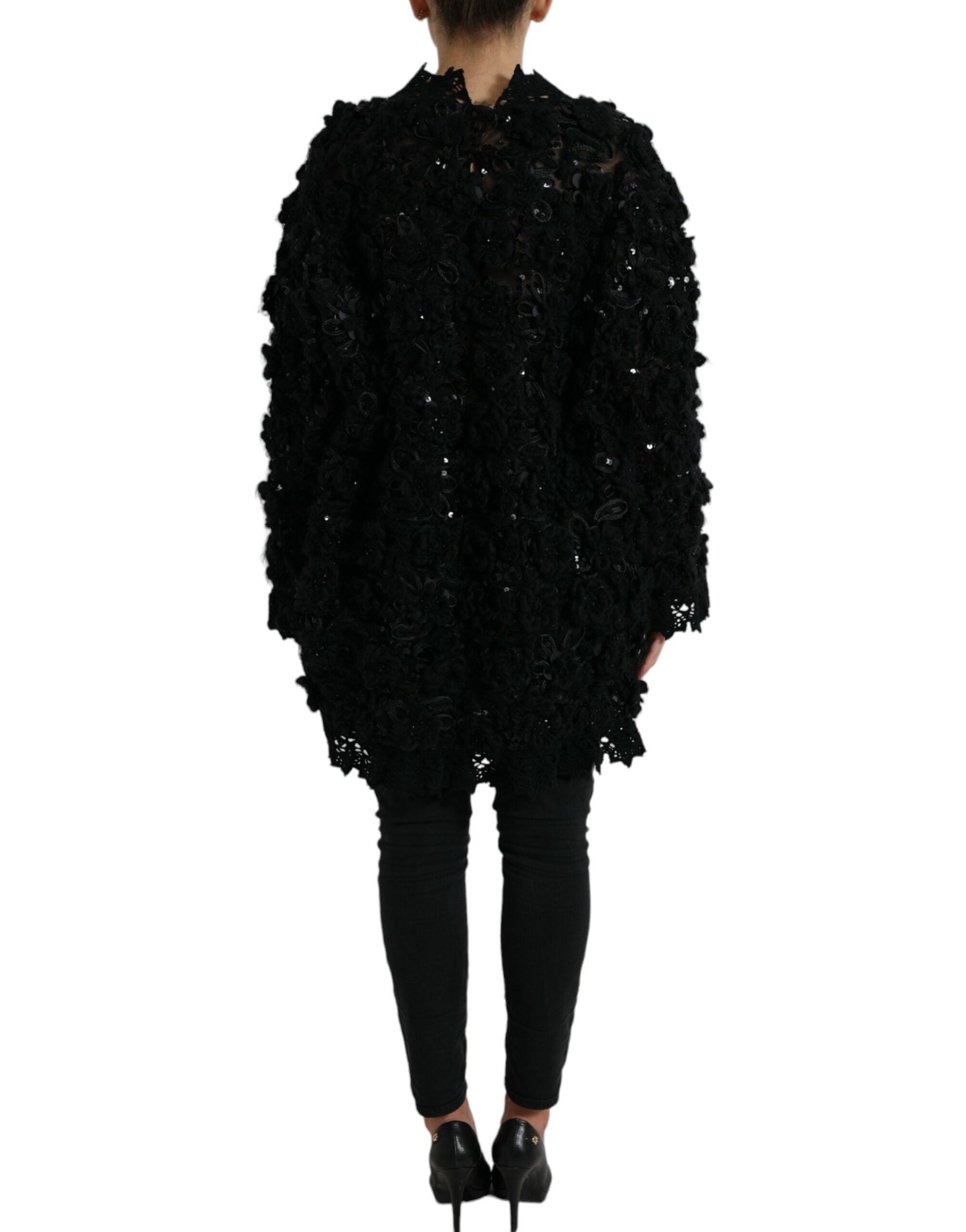 Indulge in the exquisite allure of the Dolce & Gabbana Black Sequined Embellished Pullover Sweater, a masterpiece of Italian craftsmanship that elevates your wardrobe with timeless elegance.