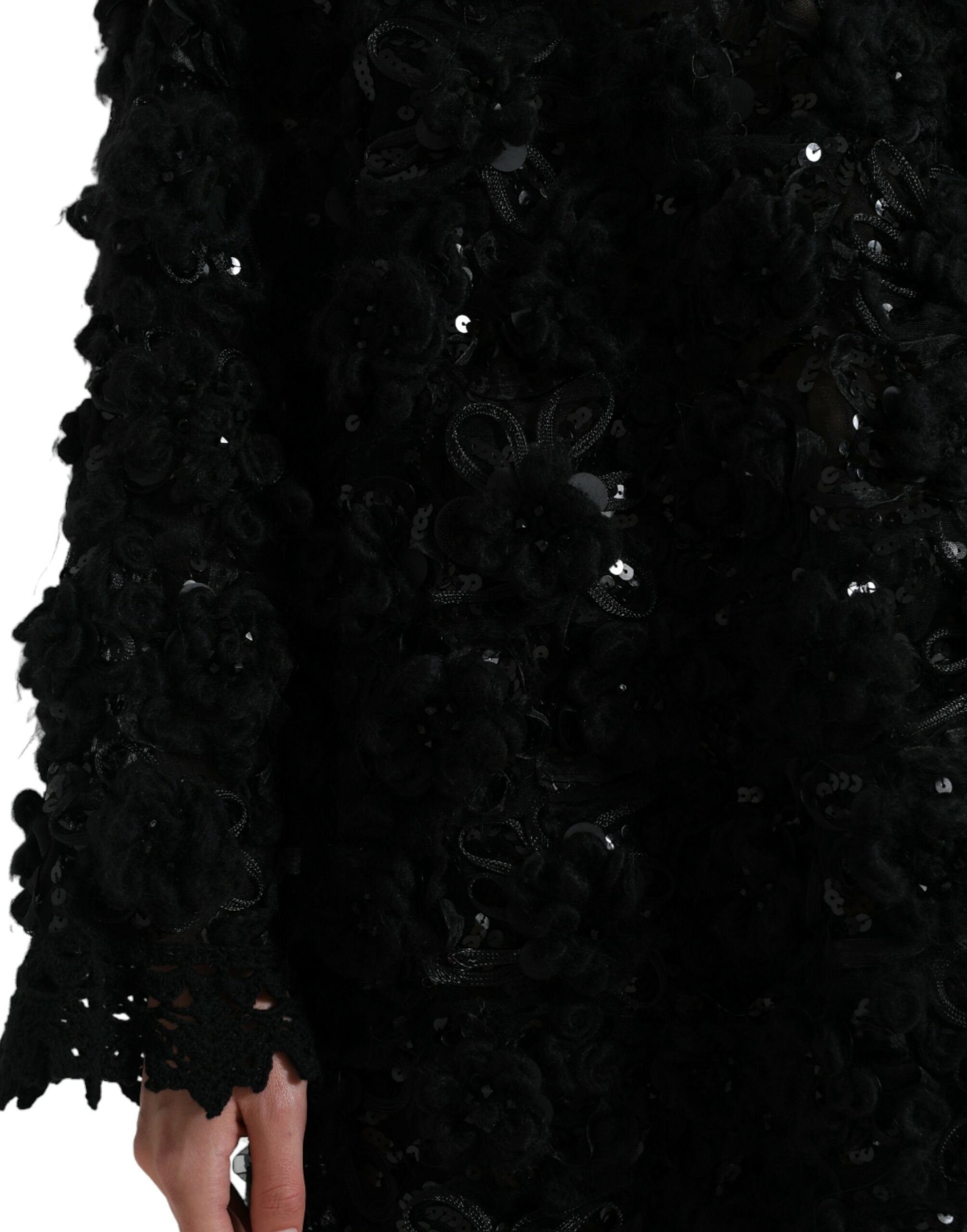Indulge in the exquisite allure of the Dolce & Gabbana Black Sequined Embellished Pullover Sweater, a masterpiece of Italian craftsmanship that elevates your elegance for any occasion.