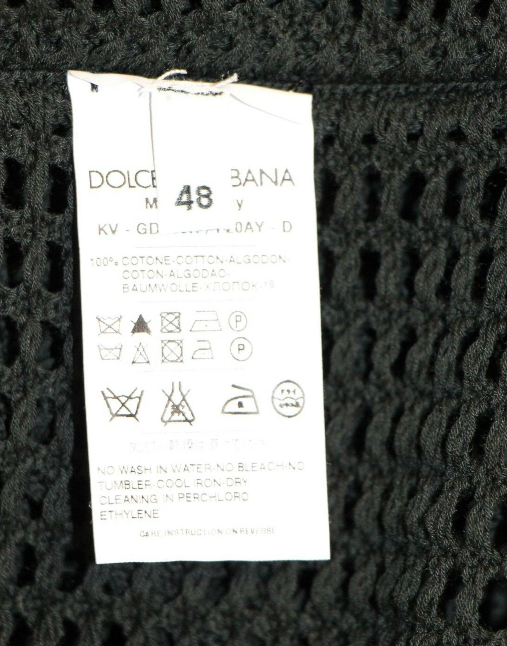 Indulge in the Dolce & Gabbana Dark Green Runway Netz Pullover, a masterpiece of Italian craftsmanship, blending luxurious cotton with a sophisticated design for timeless elegance.