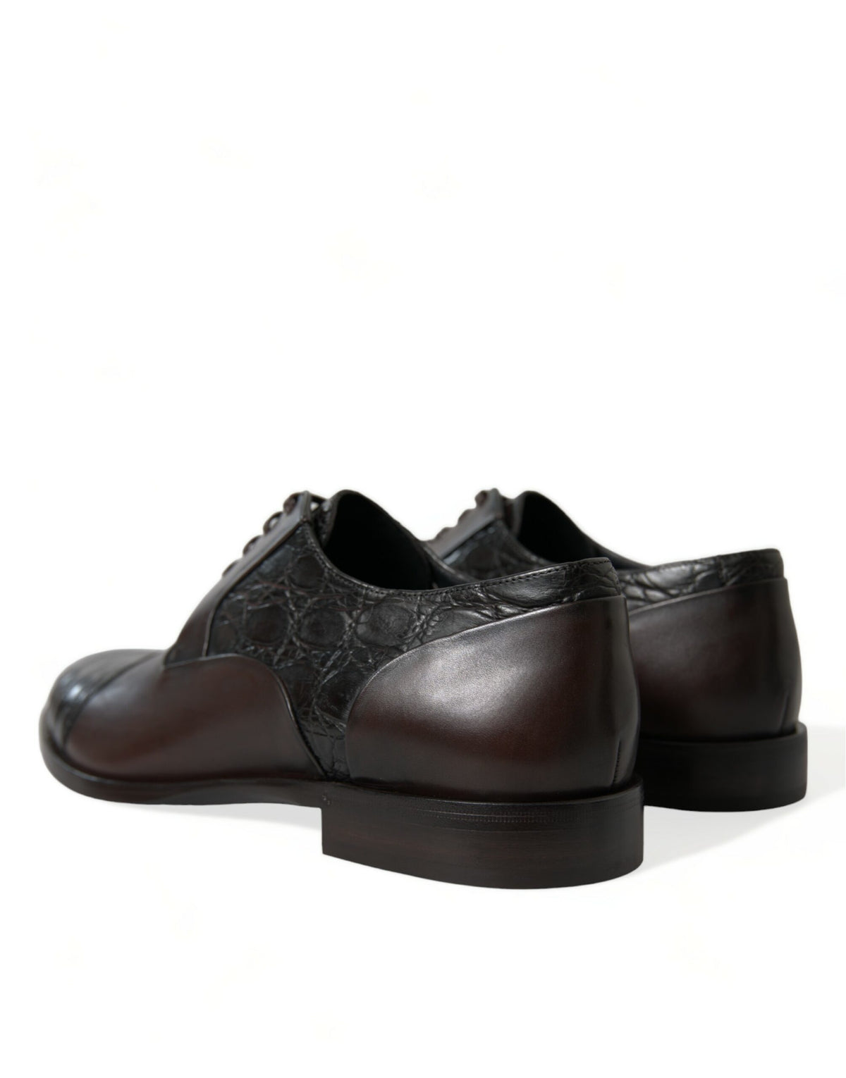 Indulge in the artisanal elegance of Dolce & Gabbana's Brown Exotic Leather Formal Men Dress Shoes, where exquisite Caiman and Calfskin craftsmanship meets timeless sophistication.