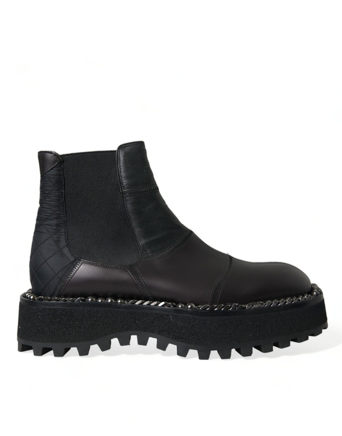 Indulge in the unparalleled elegance of Dolce & Gabbana's Black Leather Slip On Stretch Chelsea Boots, crafted in Italy from luxurious materials for the discerning individual.