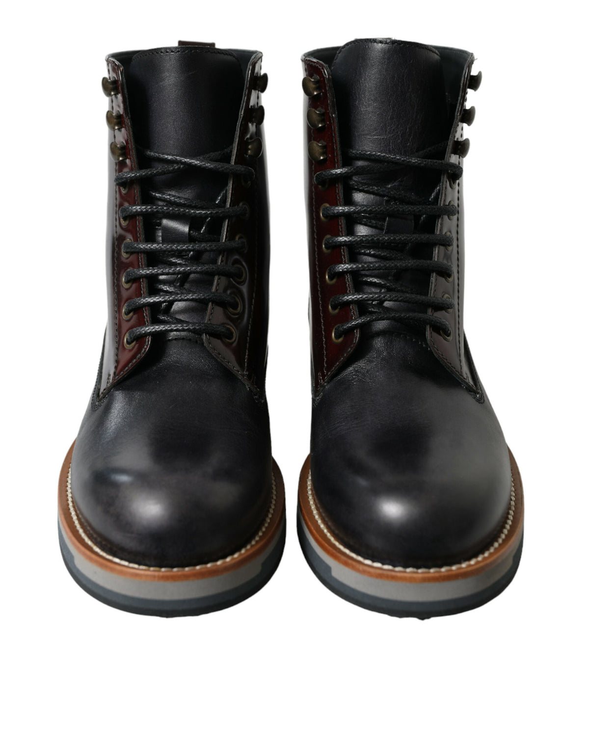 Step into luxury with Dolce & Gabbana's Black Leather Military Combat Boots, crafted from premium calf leather, embodying timeless elegance and sophisticated allure.