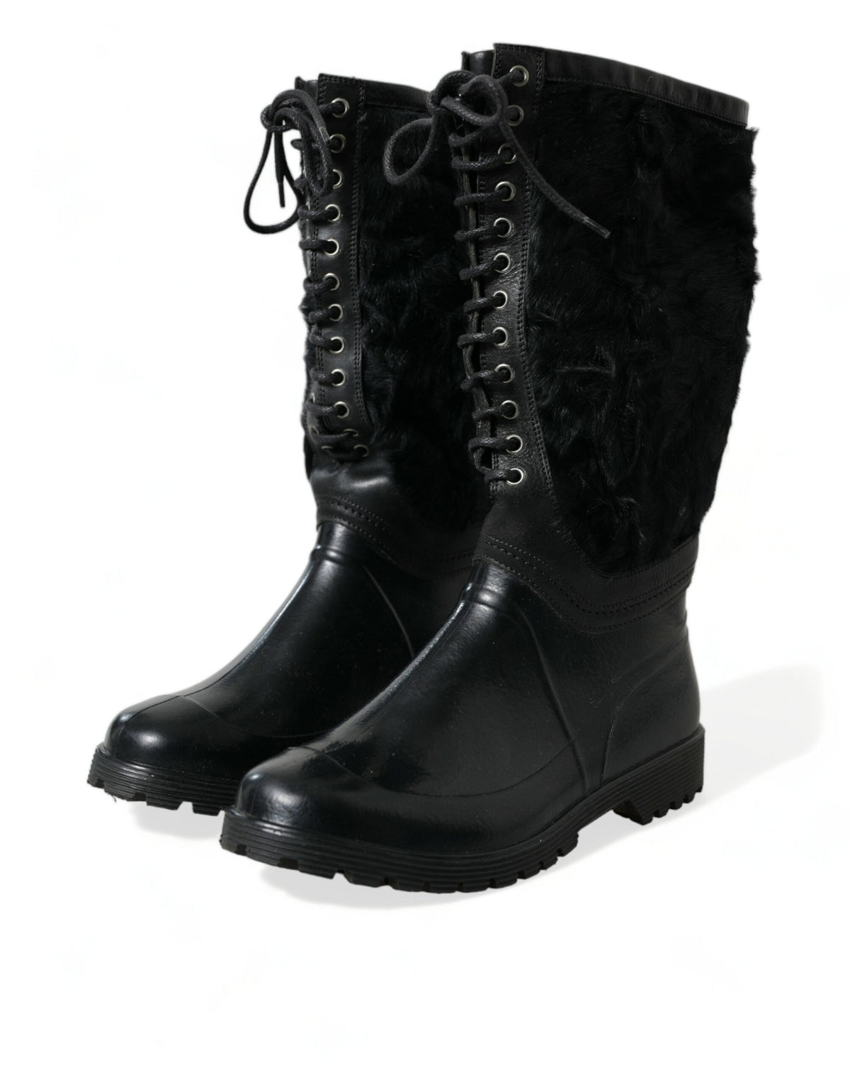 Step into the realm of luxury with Dolce & Gabbana's Black Rubber Lace Up Shearling Rain Boots, where exquisite craftsmanship meets timeless elegance for the discerning individual.